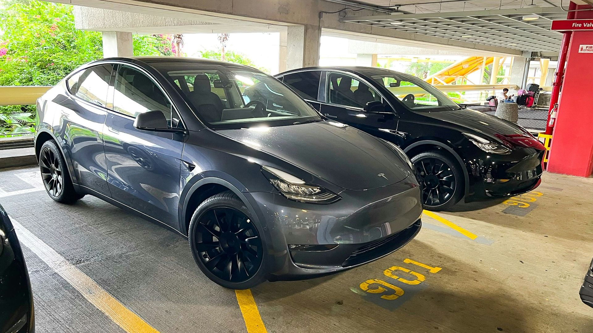 a couple of cars parked in a parking garage