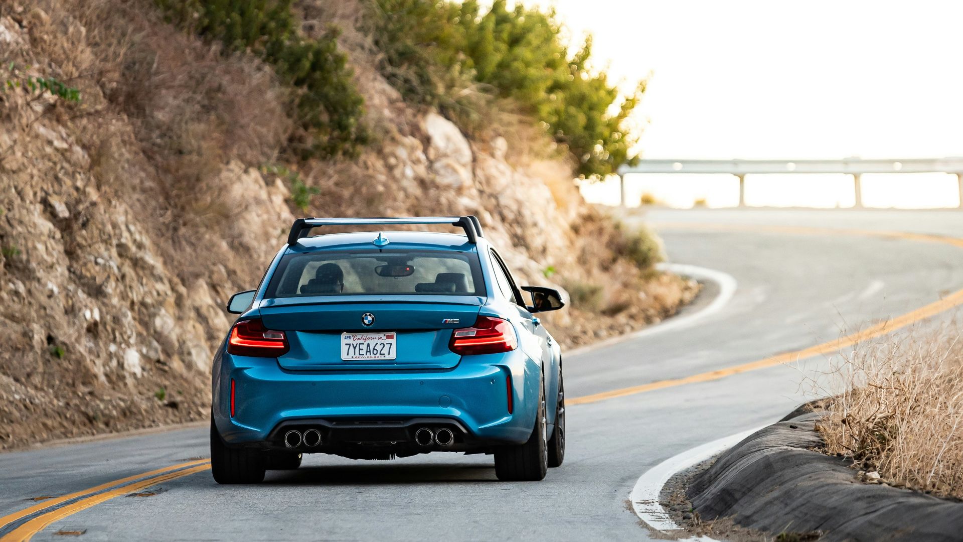 blue car on road during daytime