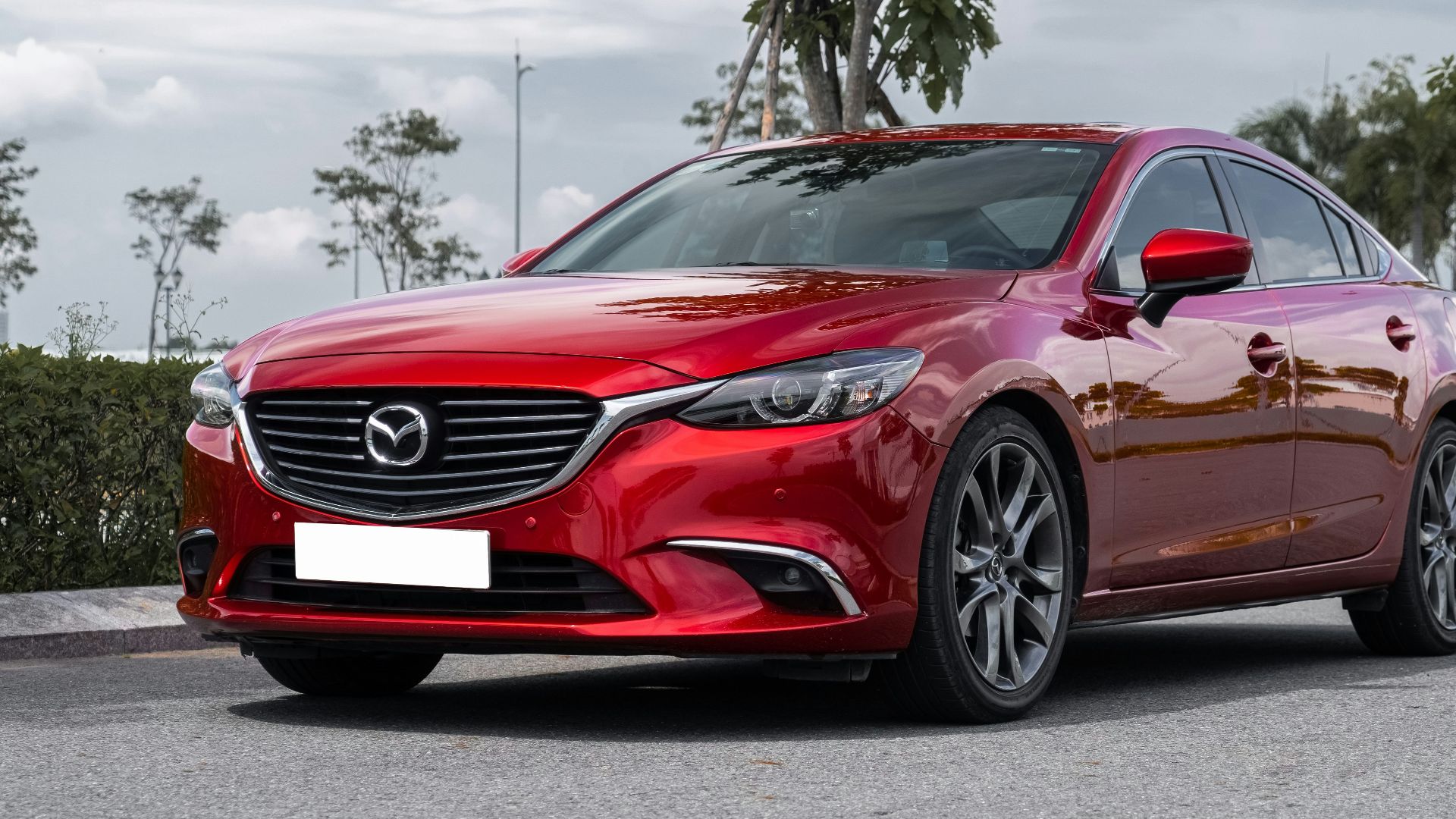 a red car parked on a street