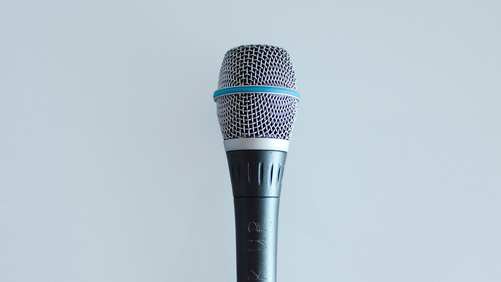 black and gray corded microphone