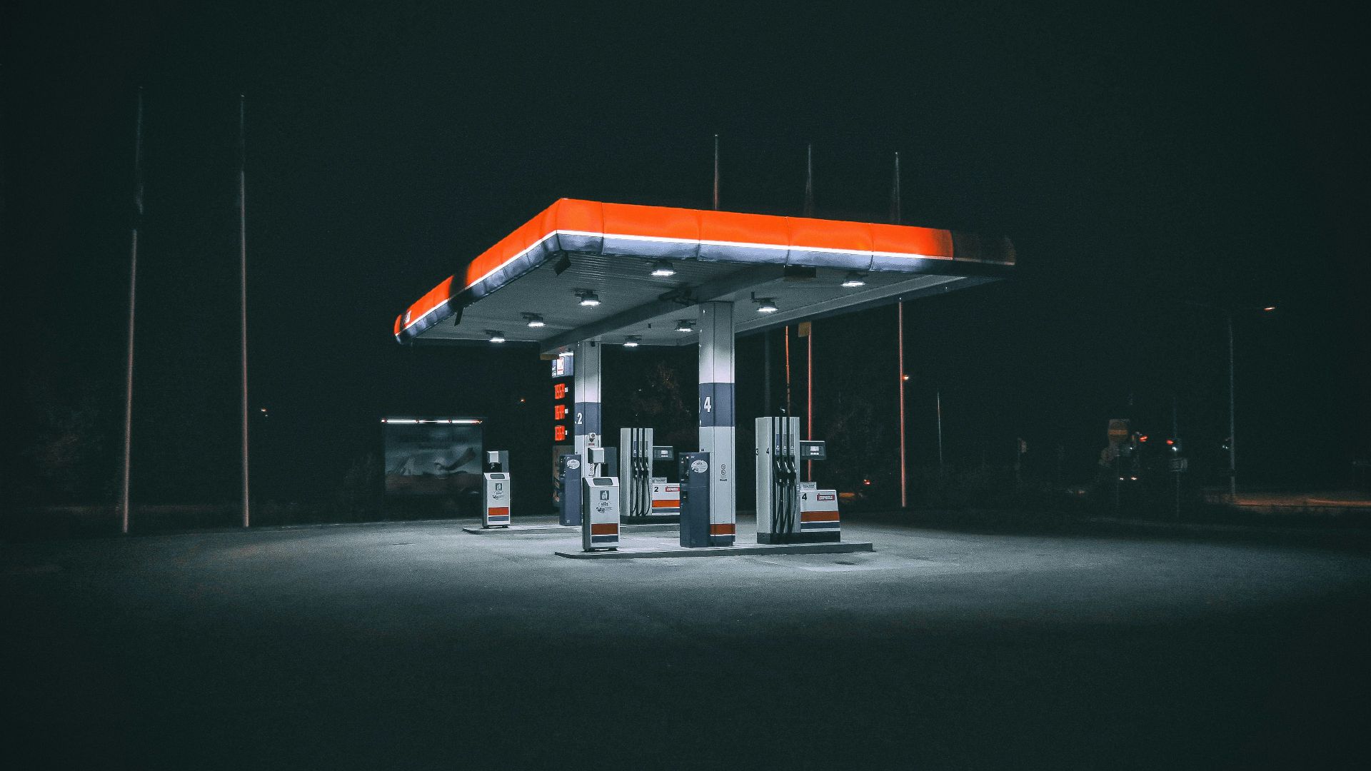 a gas station at night with no people around