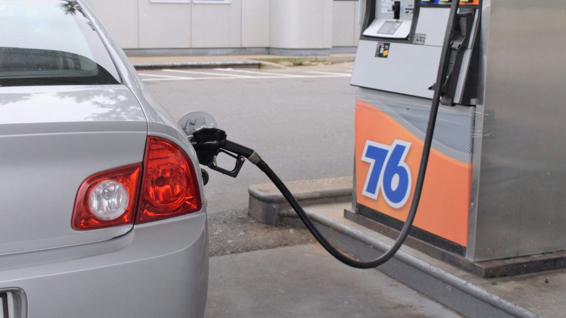 a car is parked at a gas pump