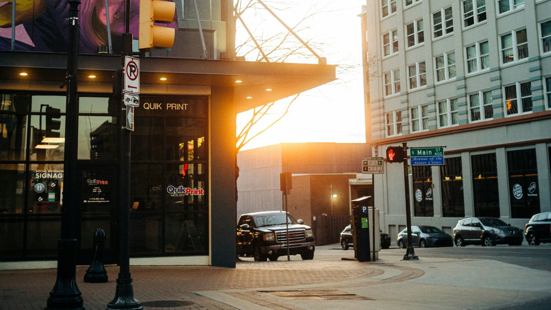 a street with a building with a mural on it