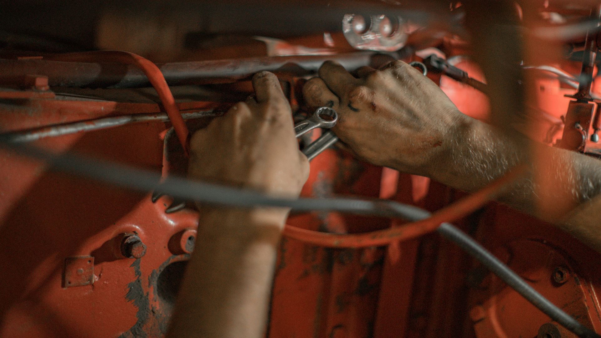 person holding red metal frame