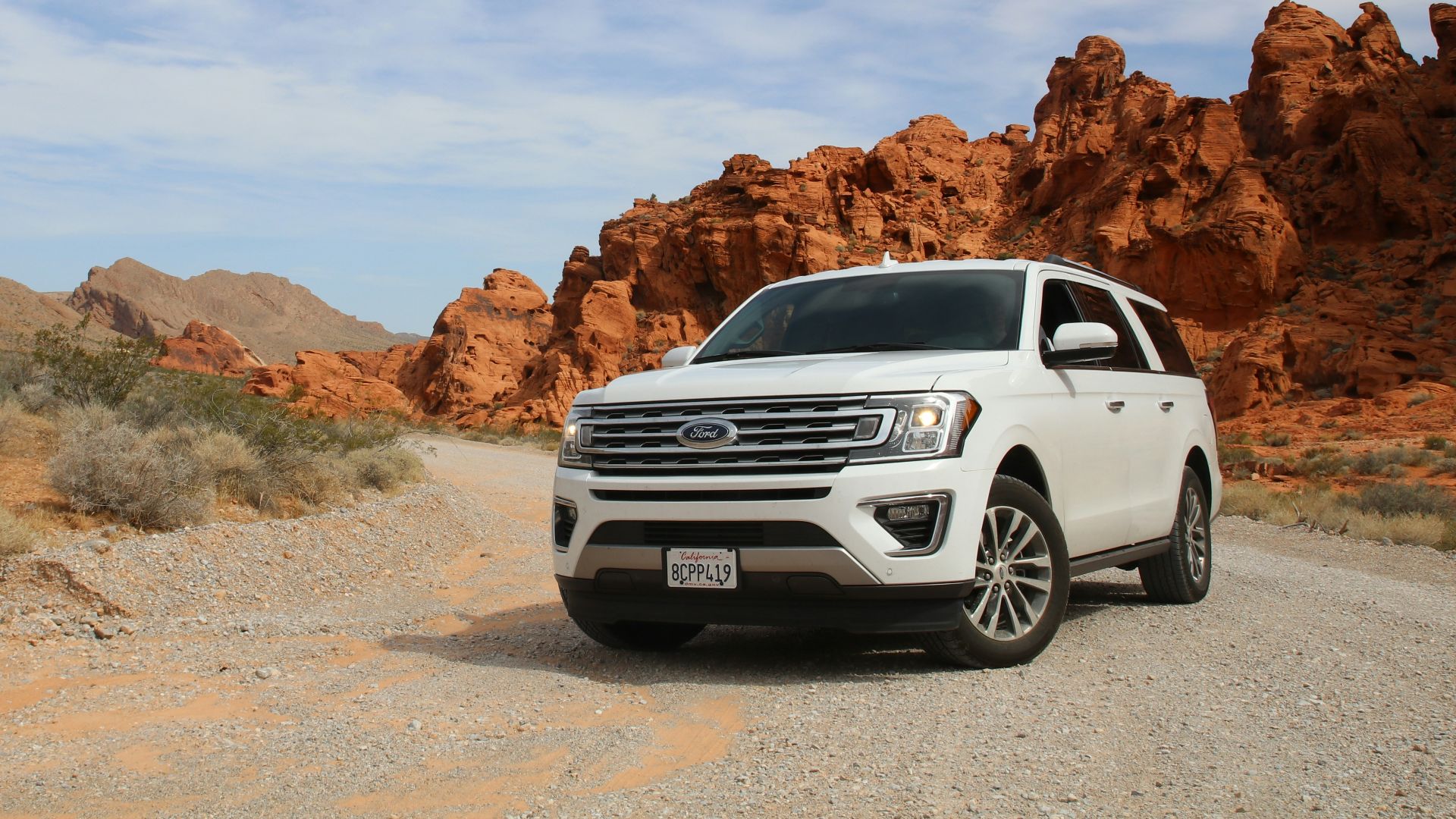 parked white Ford Explorer SUV