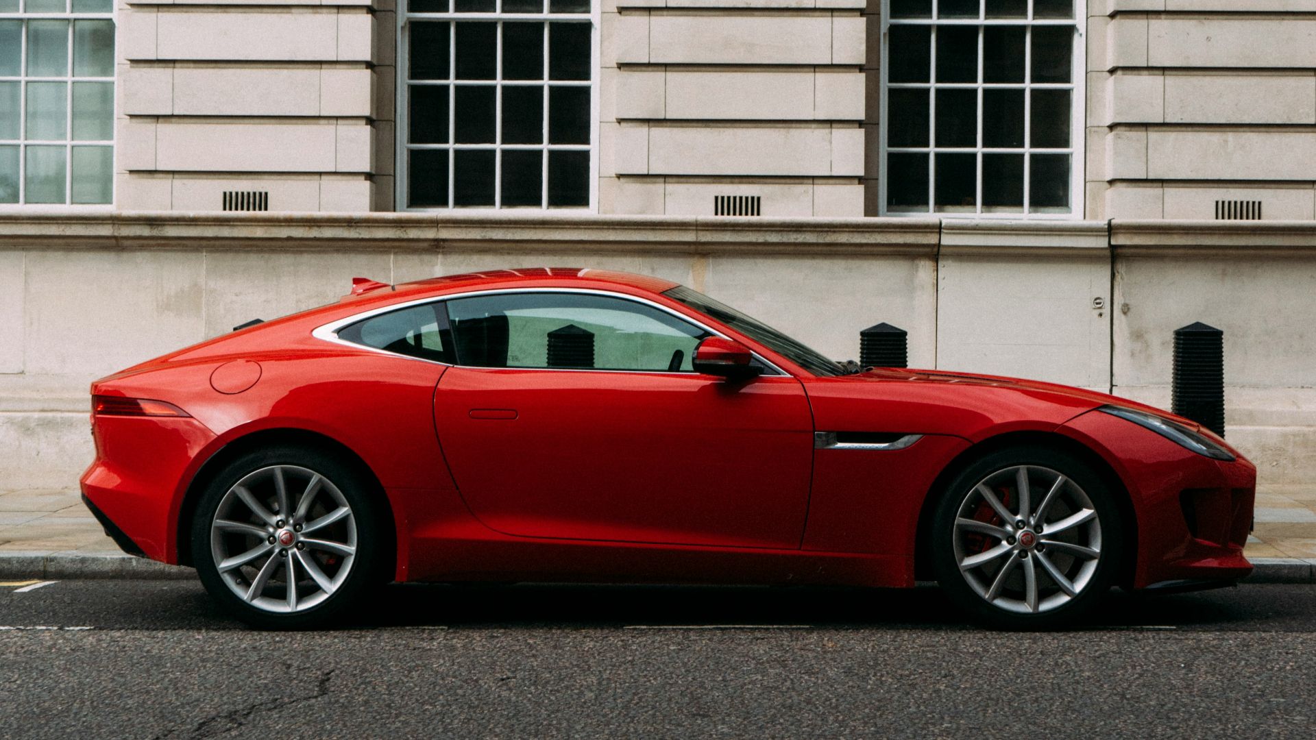 red coupe during daytime