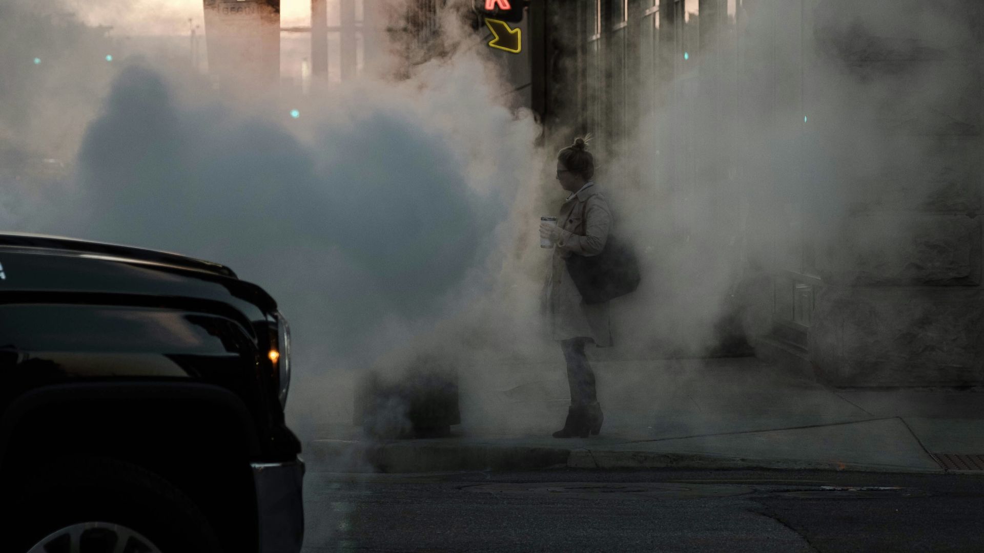 woman standing on road near building structures