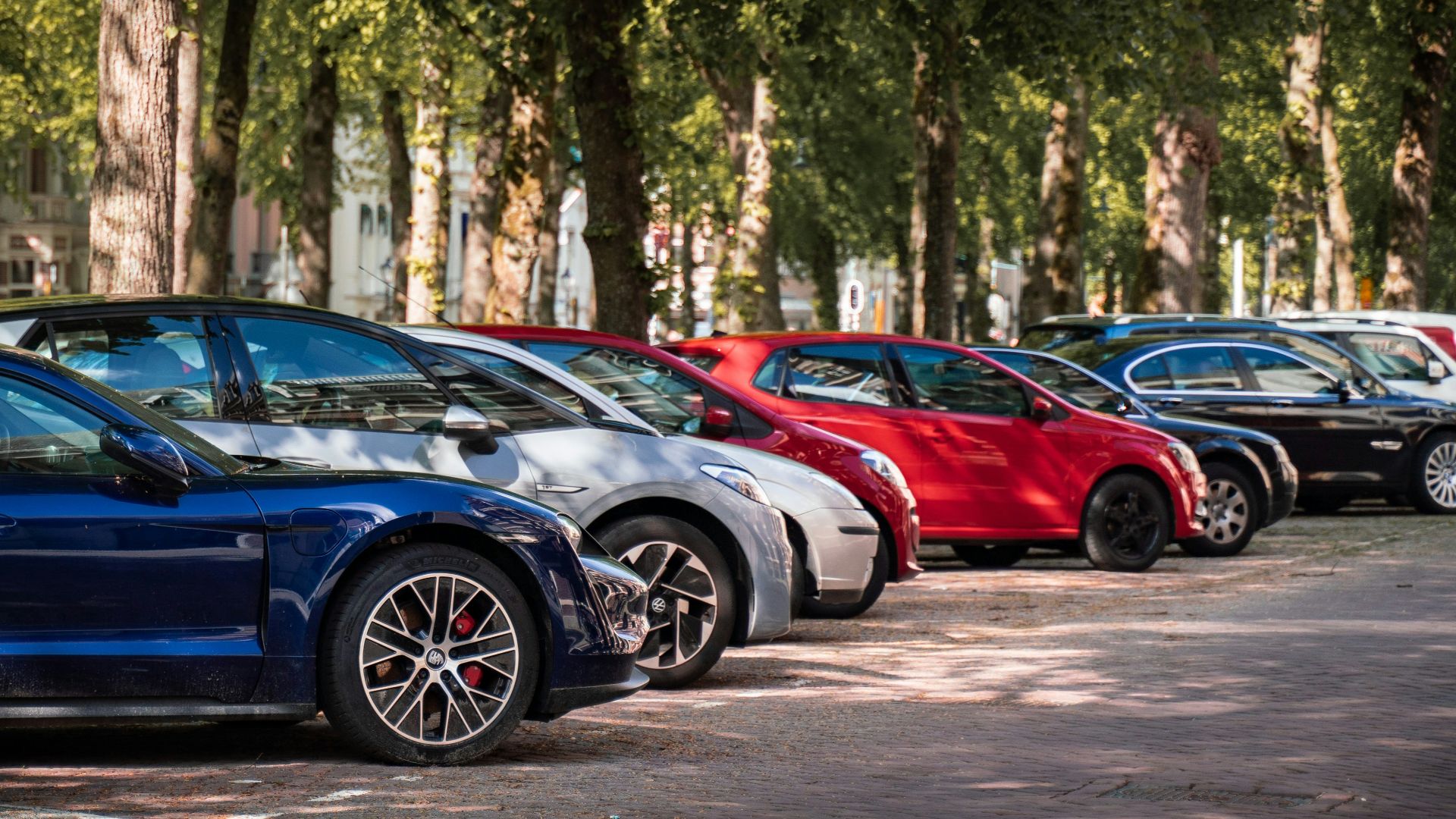 blue and red sports car on road during daytime