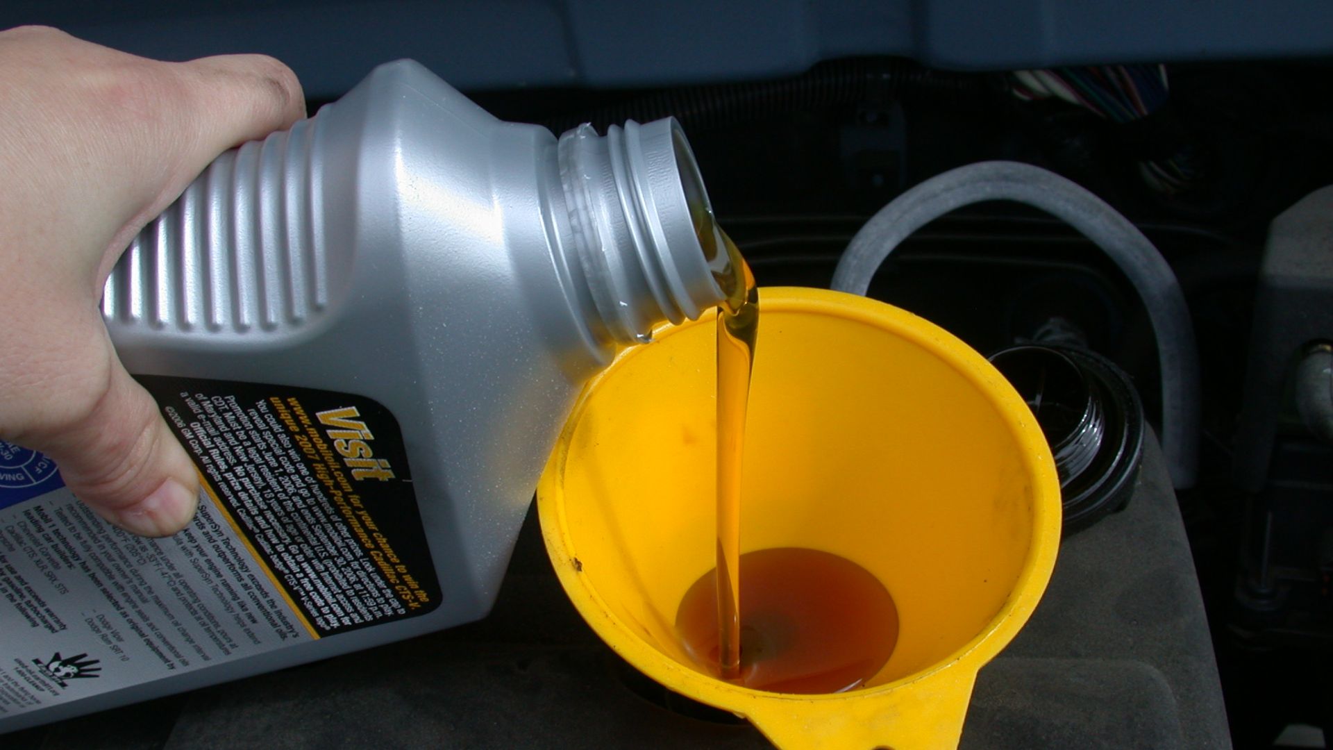 File:Motor oil refill with funnel.JPG
