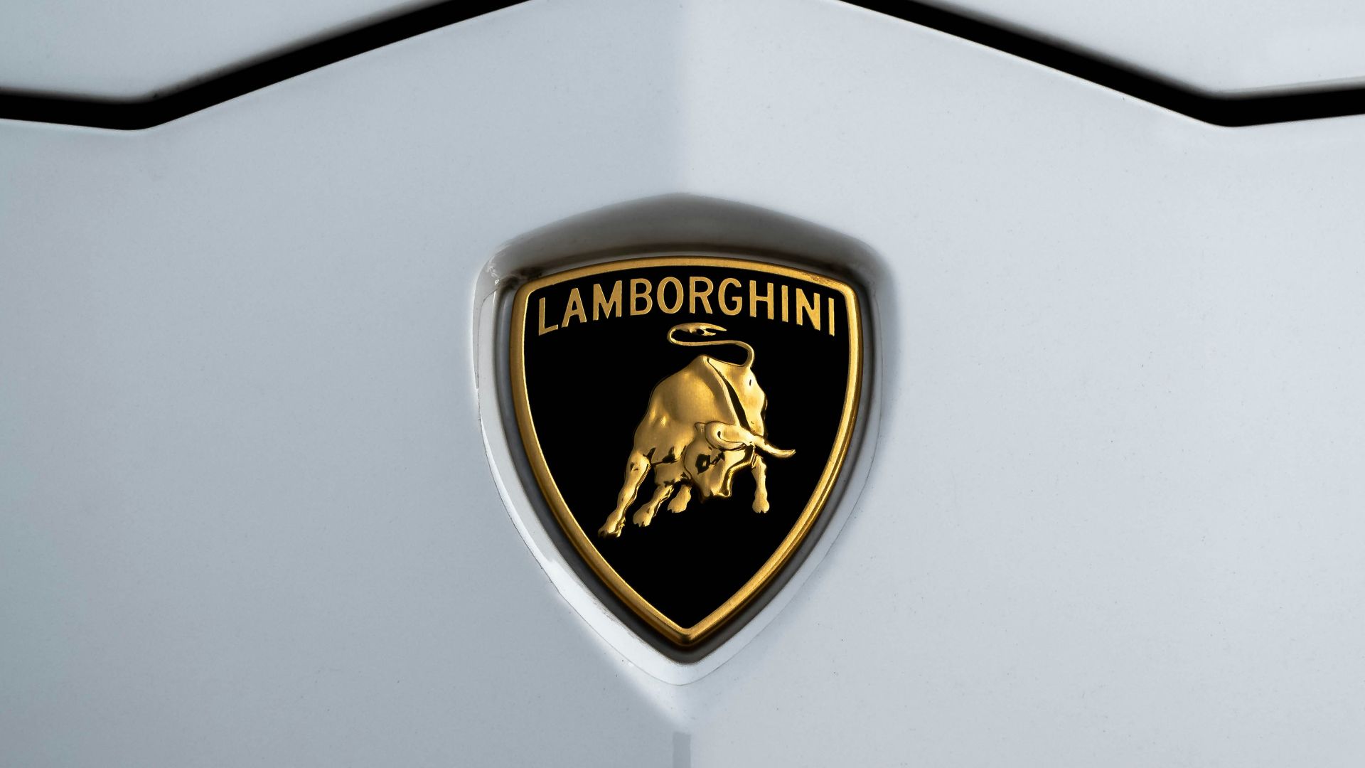 gold and black heart shaped logo