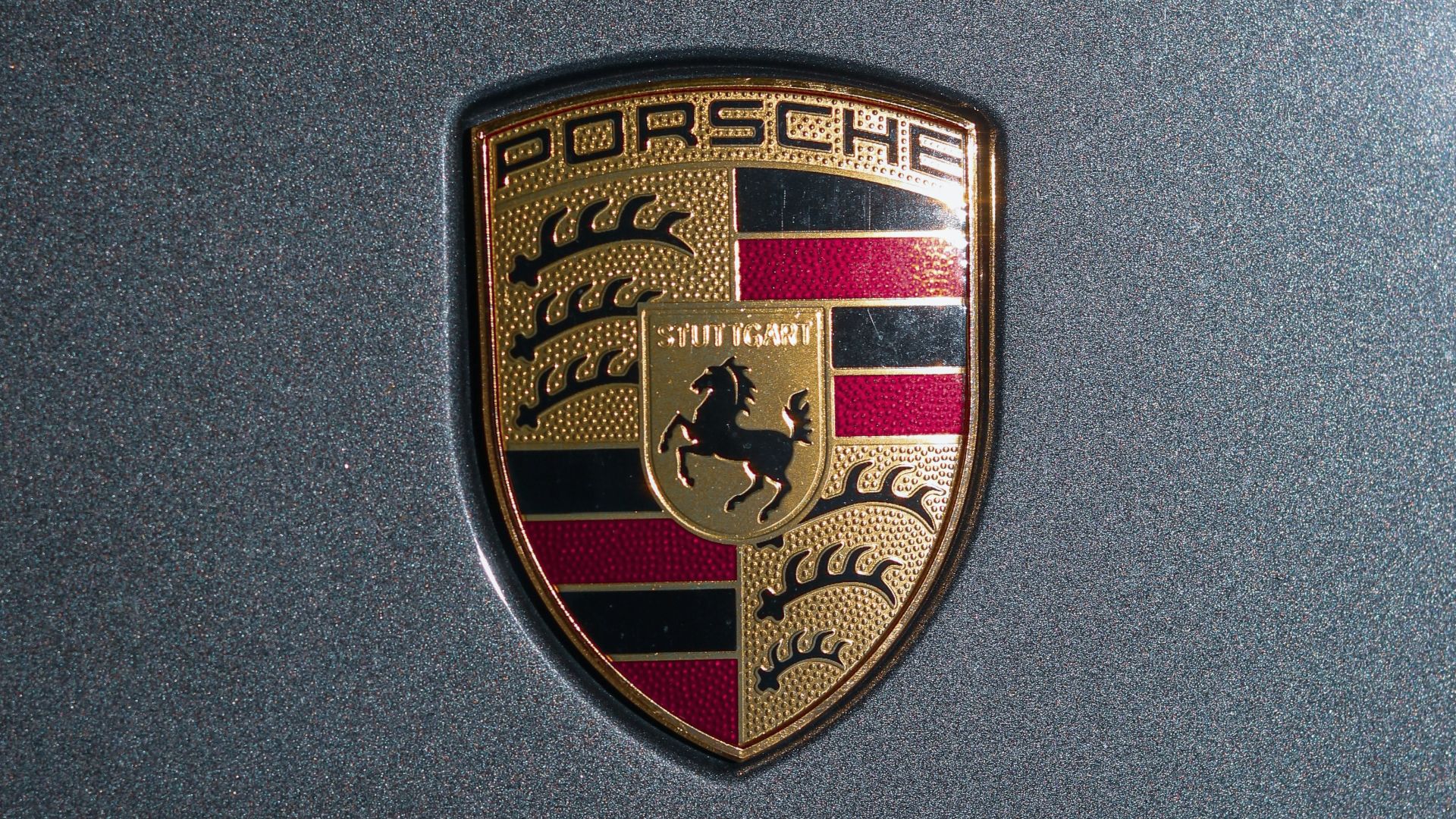 a close up of a porsche emblem on a car