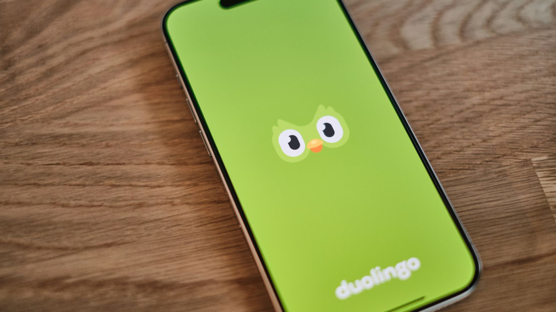 A green phone with a face drawn on it