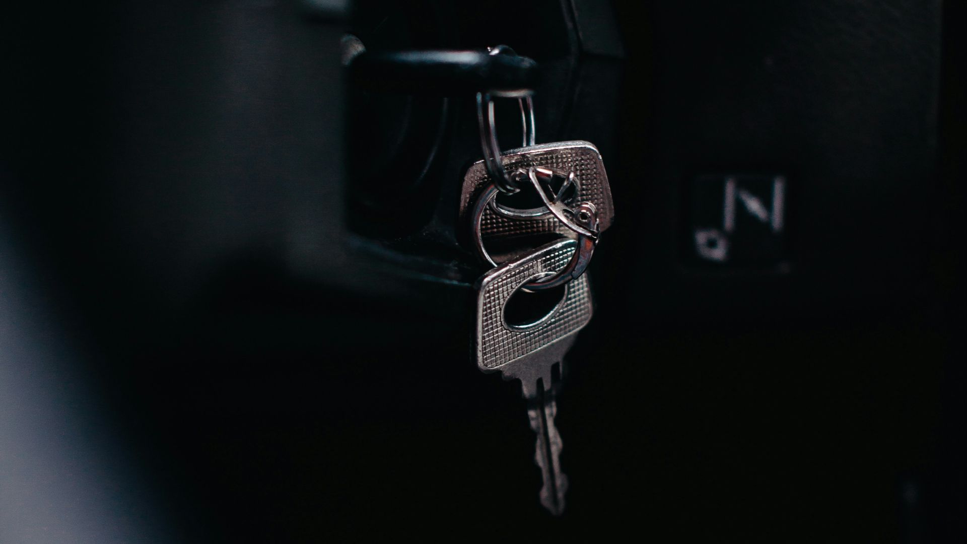 silver key on black car