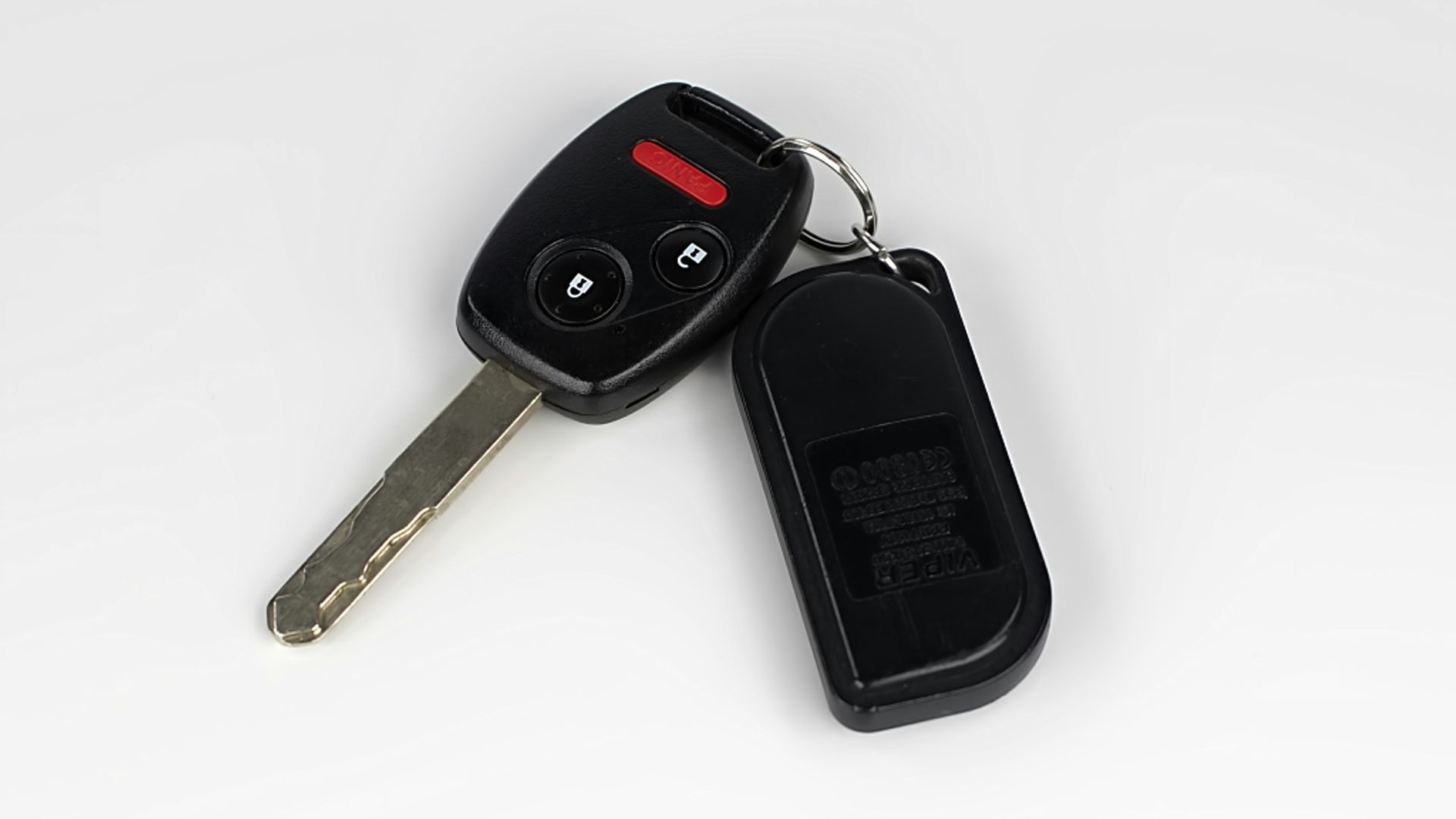 a car key with a remote control attached to it