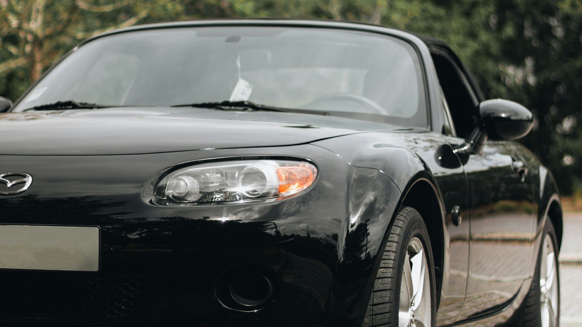 a black car parked on a road