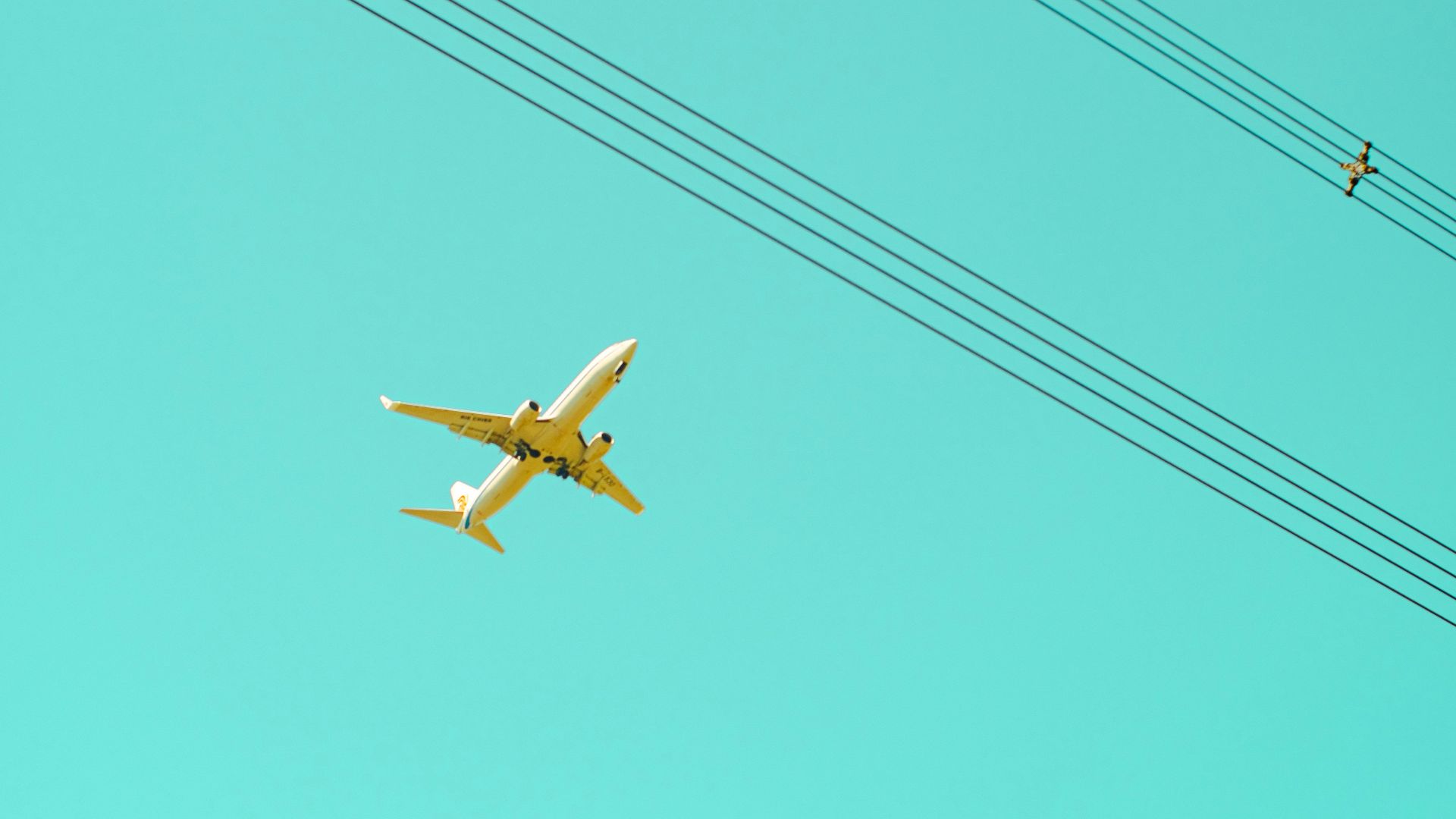 An airplane flies above the sky.