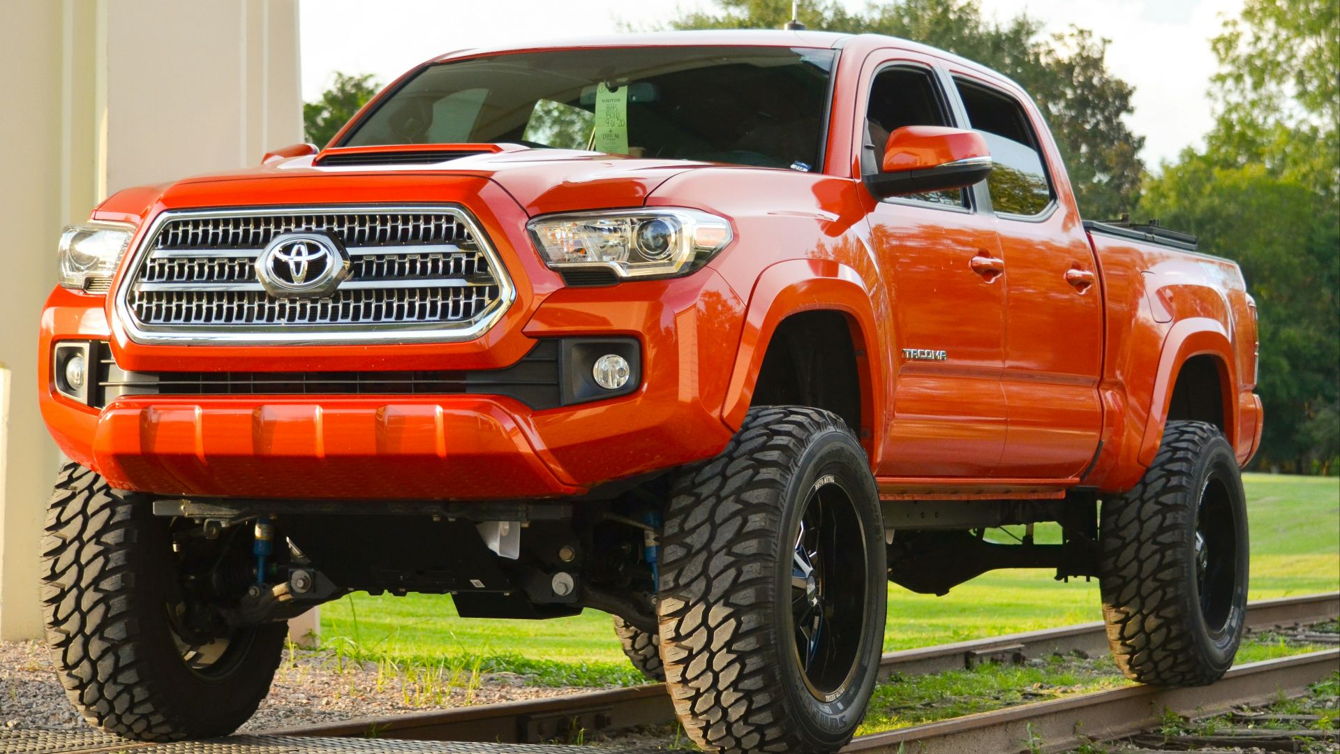 red chevrolet crew cab pickup truck