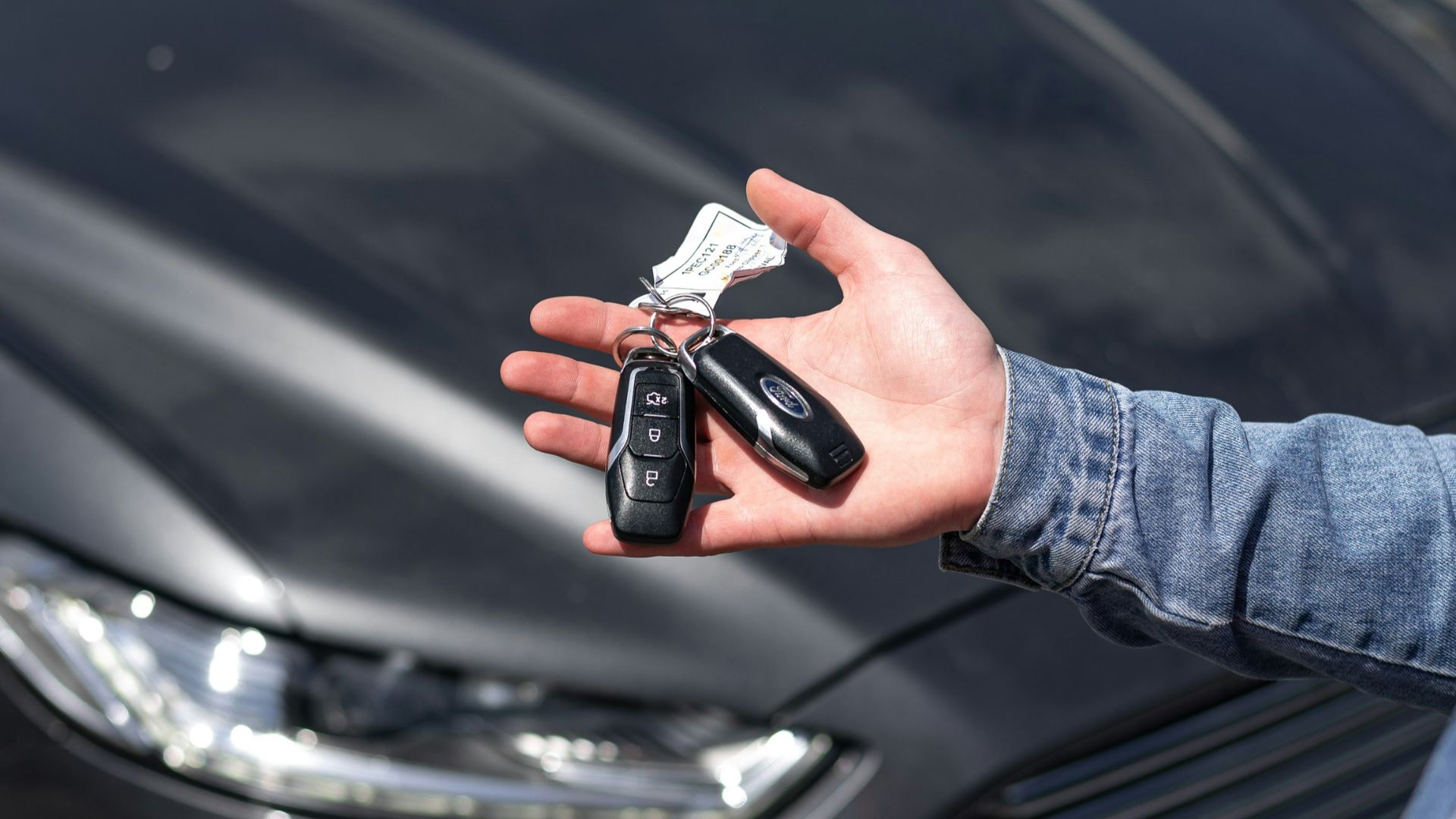 a hand holding a key