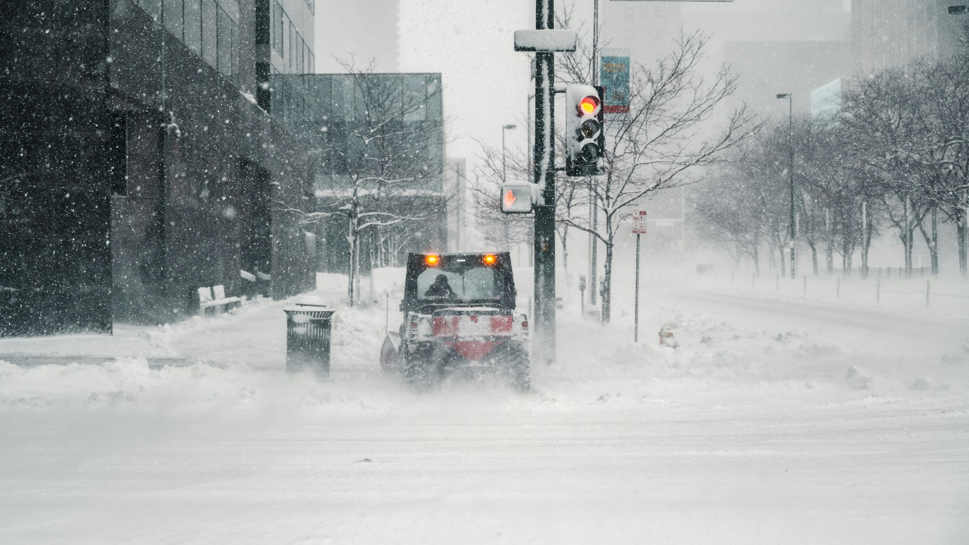 black car on snow covered road during daytime
