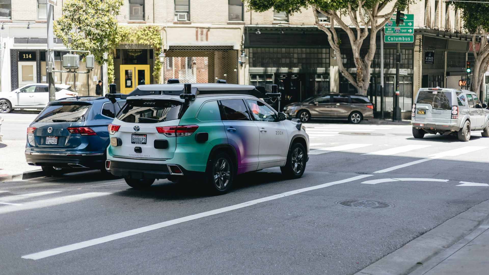 a couple of cars that are sitting in the street
