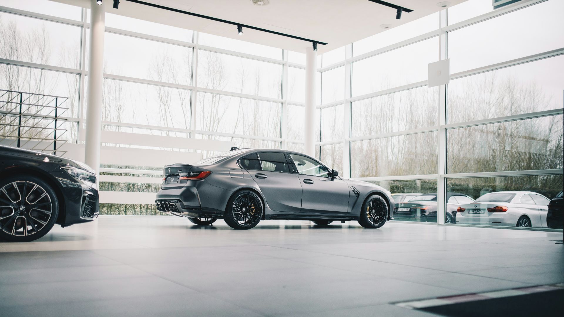 black coupe parked in a building