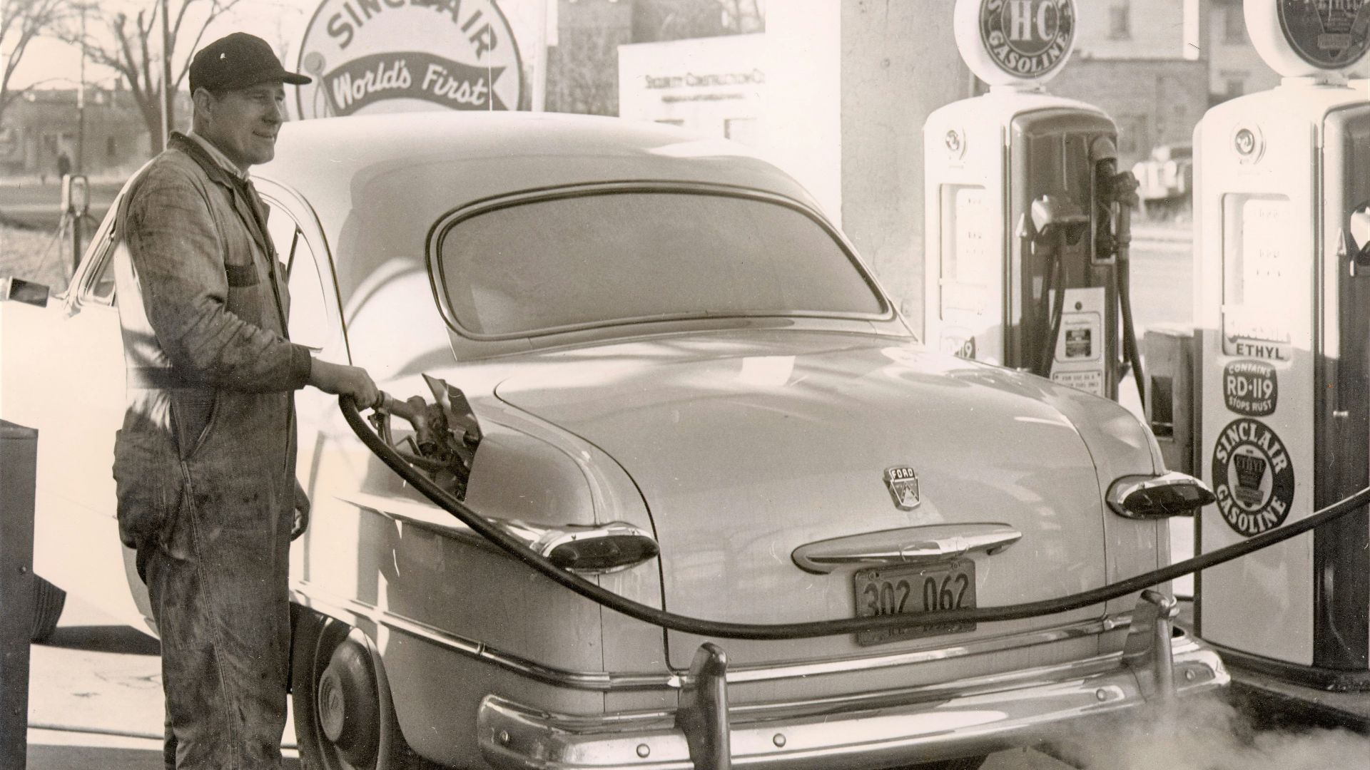 a man standing next to a car