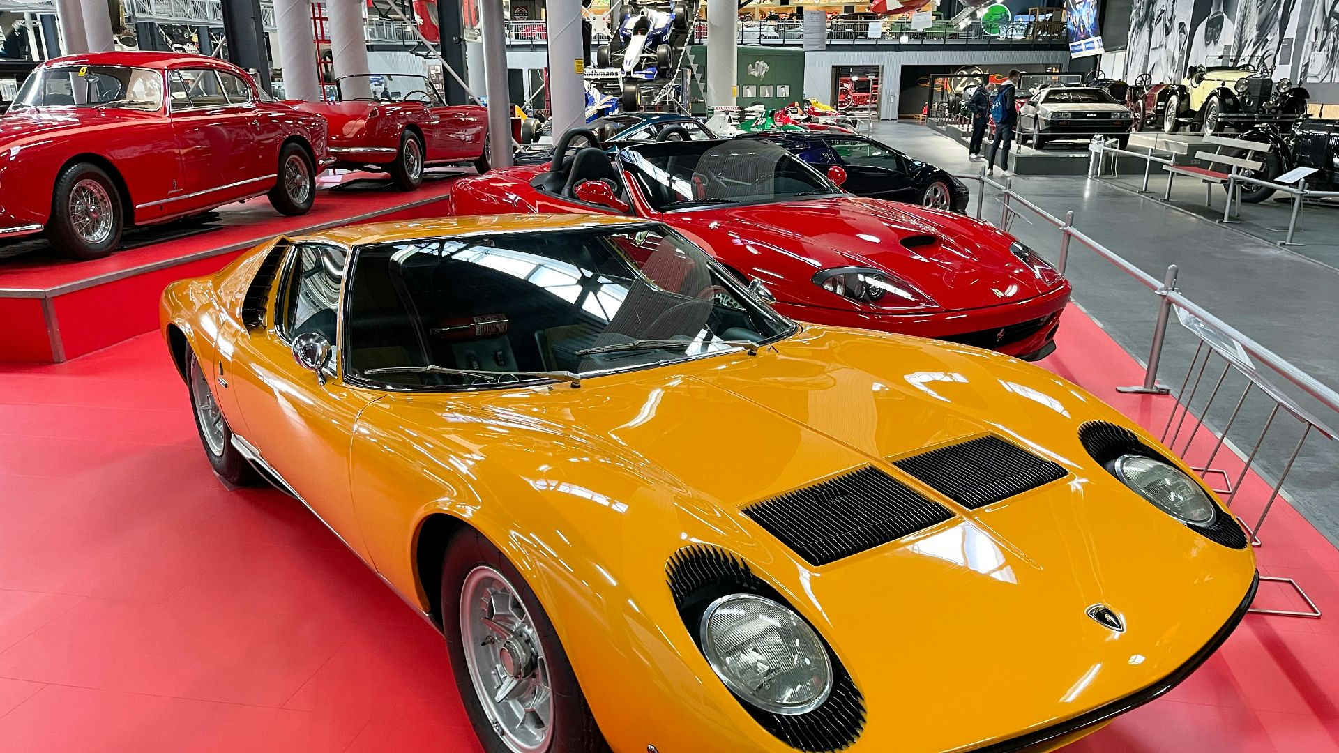 a group of cars parked in a showroom
