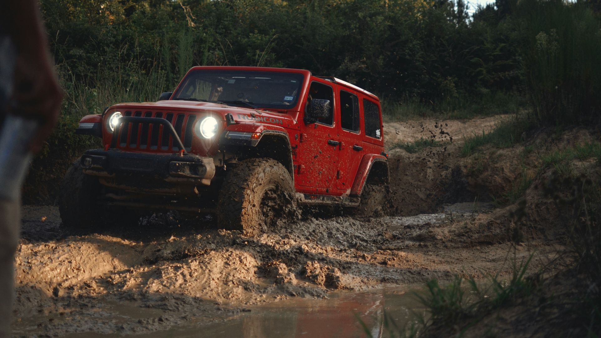 red suv on brown dirt road during daytime