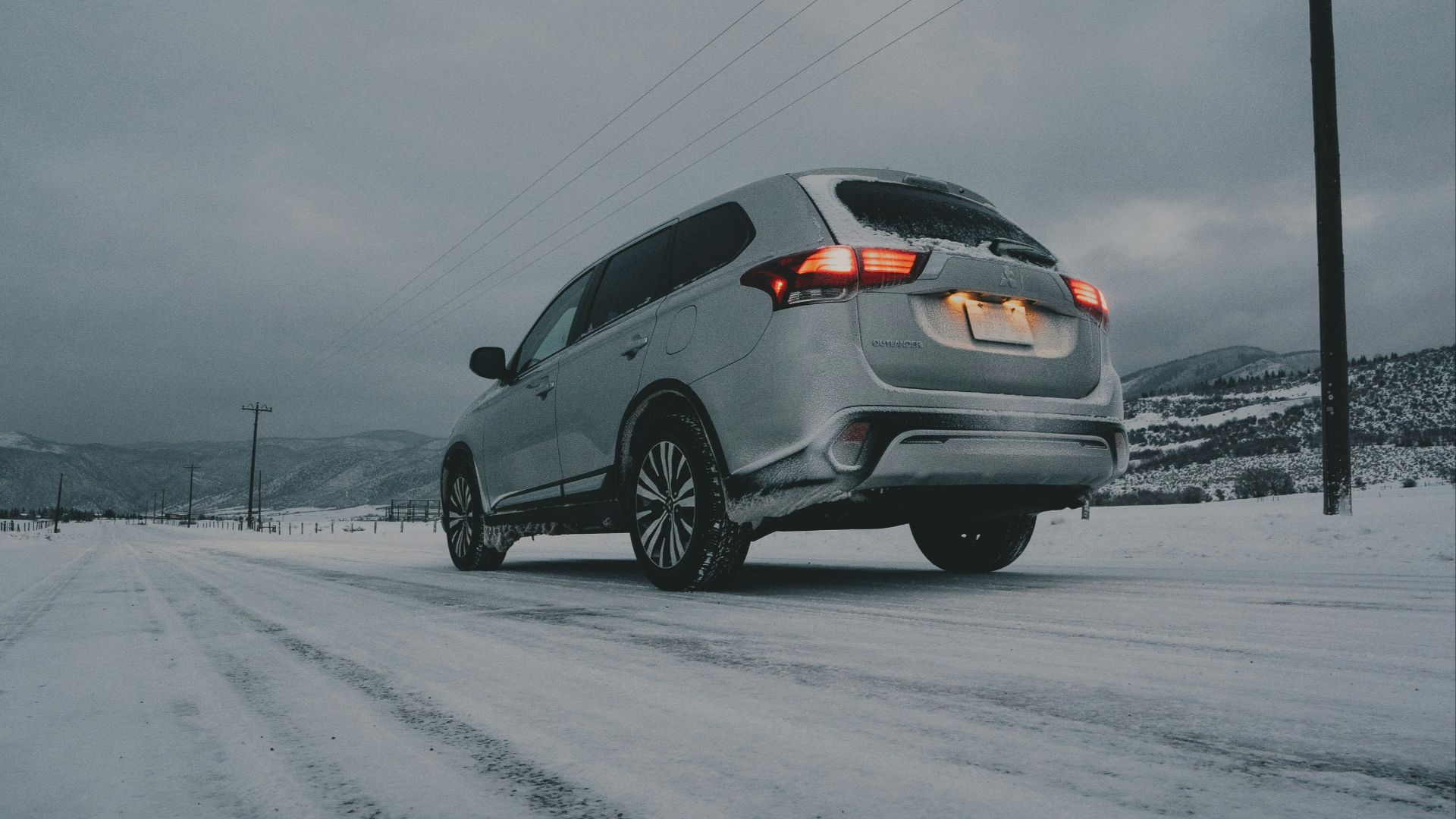 gray vehicle on snow field