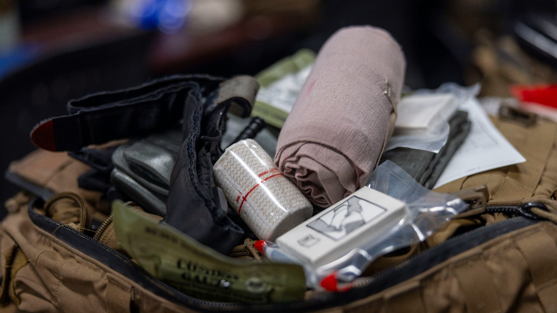 First aid kit contents with bandages and medical supplies