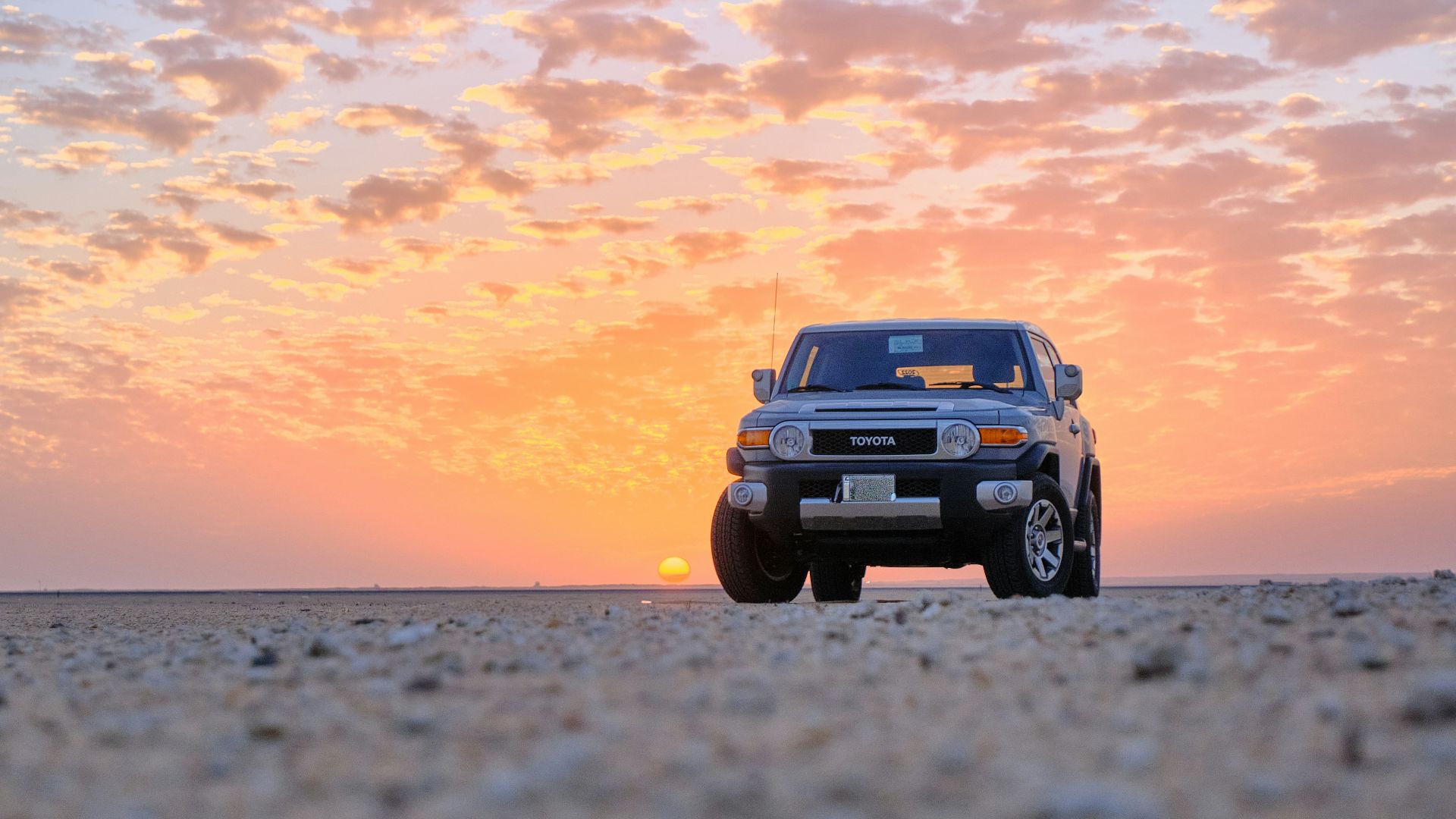a car parked on a beach