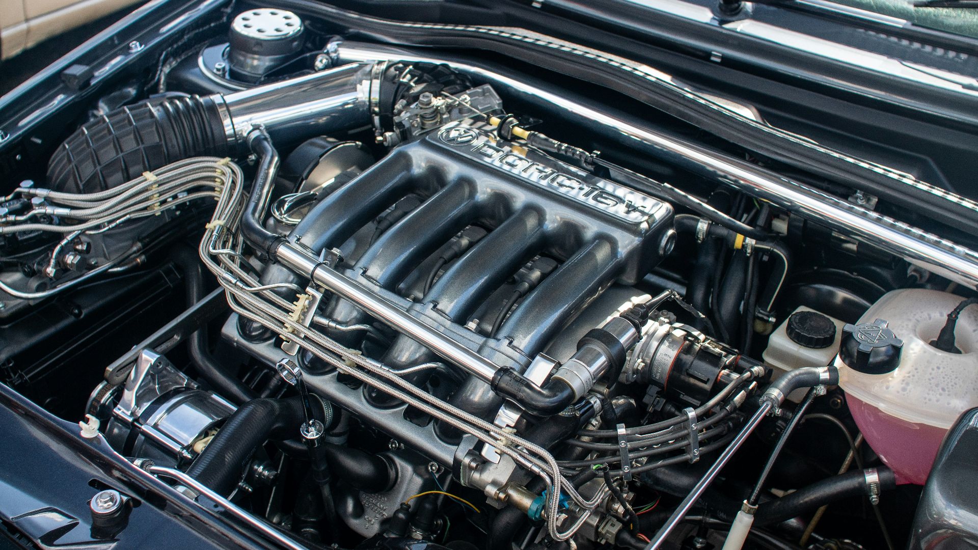 The engine compartment of a car with the hood up