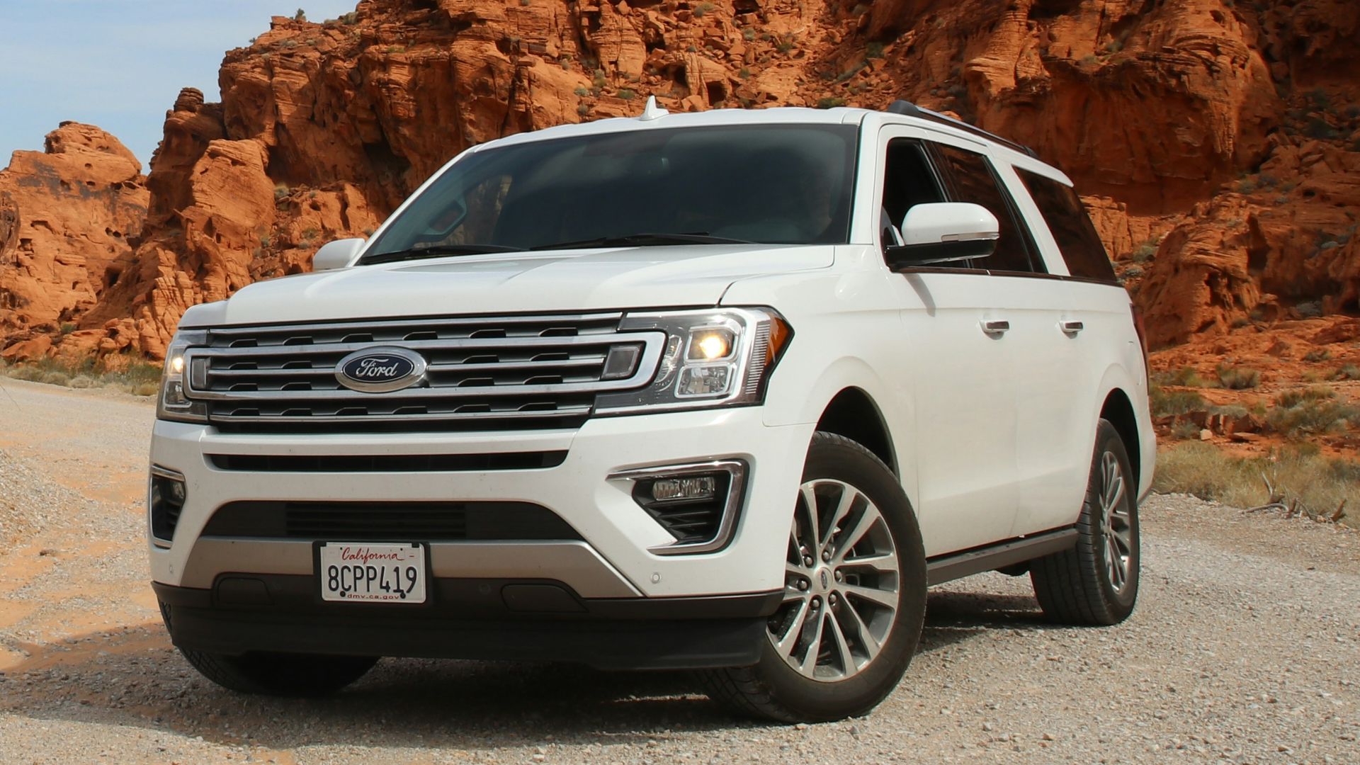 parked white Ford Explorer SUV