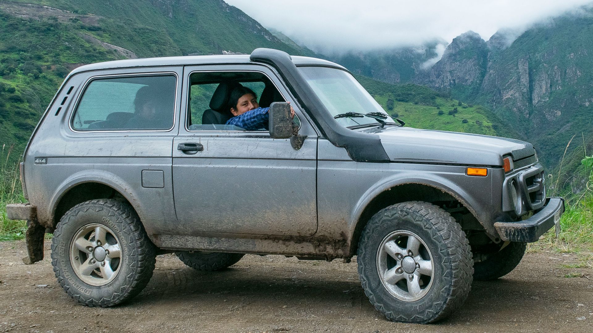 a person driving a jeep
