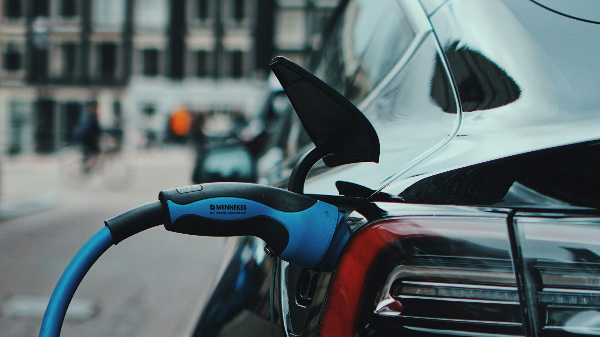 white and black car in front of white building during daytime