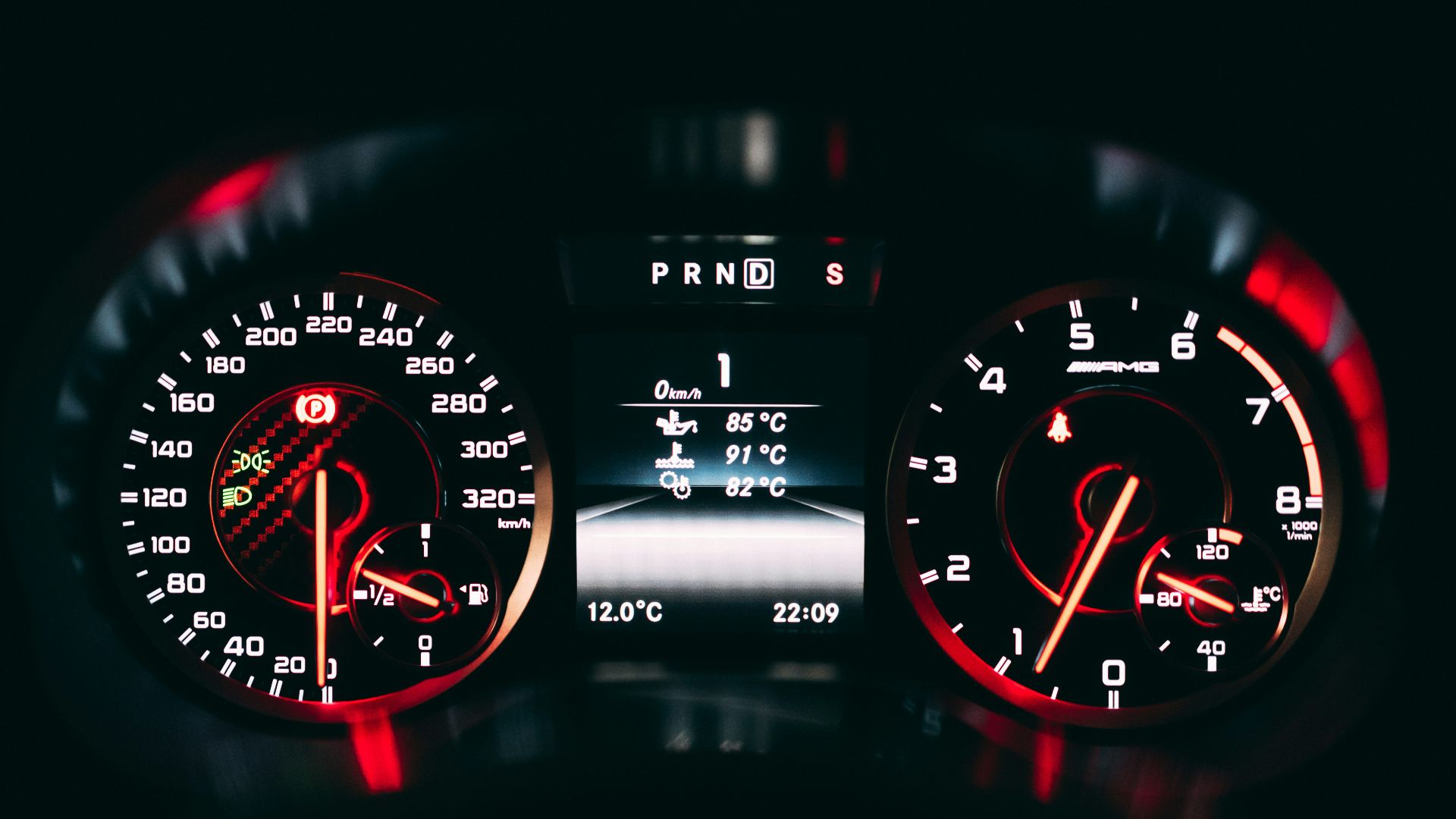 black and red analog speedometer