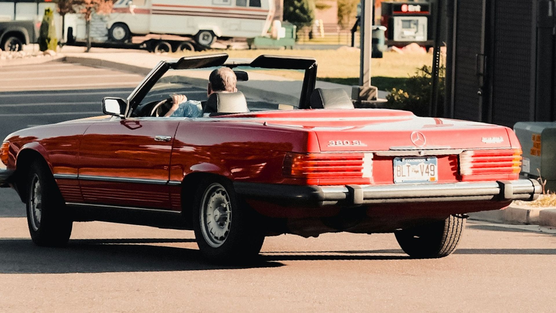 Red convertible car parked on a sunny day