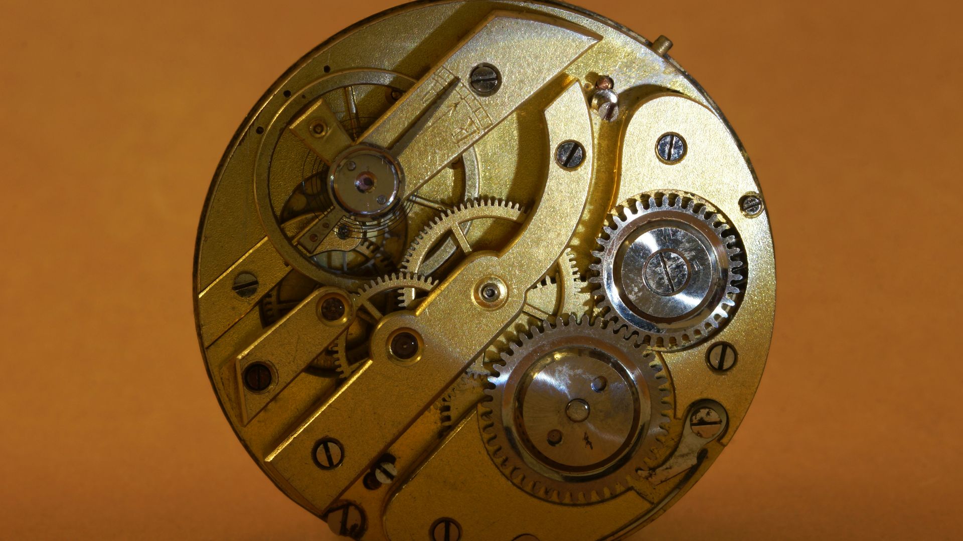 a close up of a clock on a table
