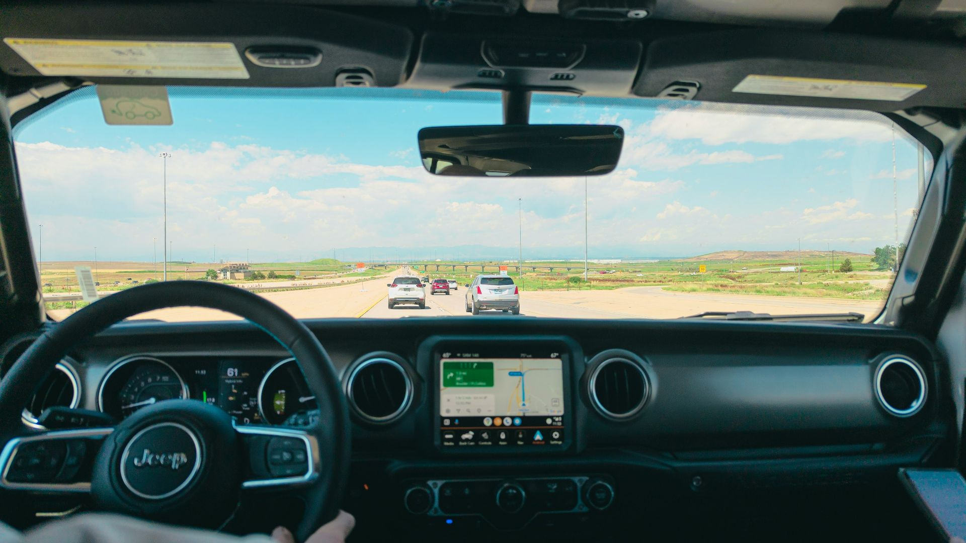 a man driving a truck on a highway