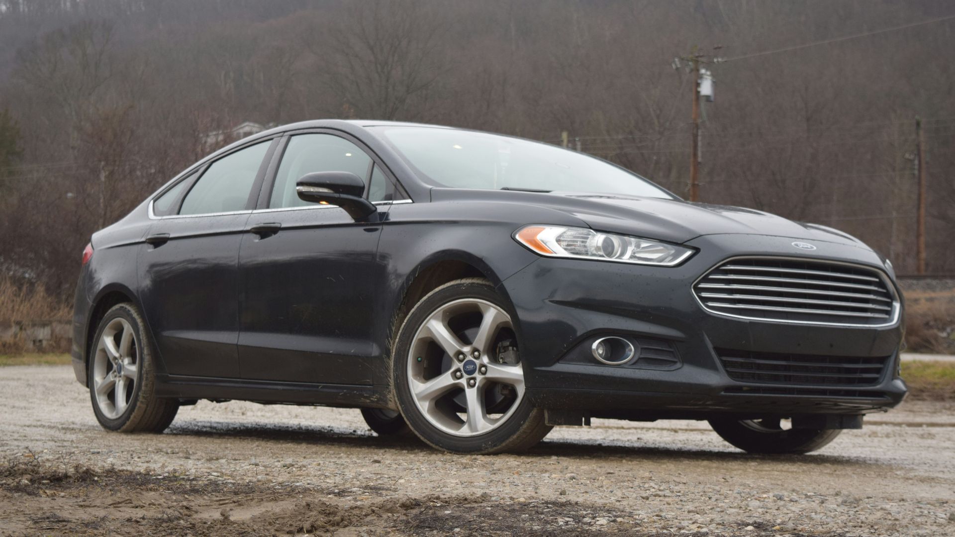 a black car parked in a parking lot