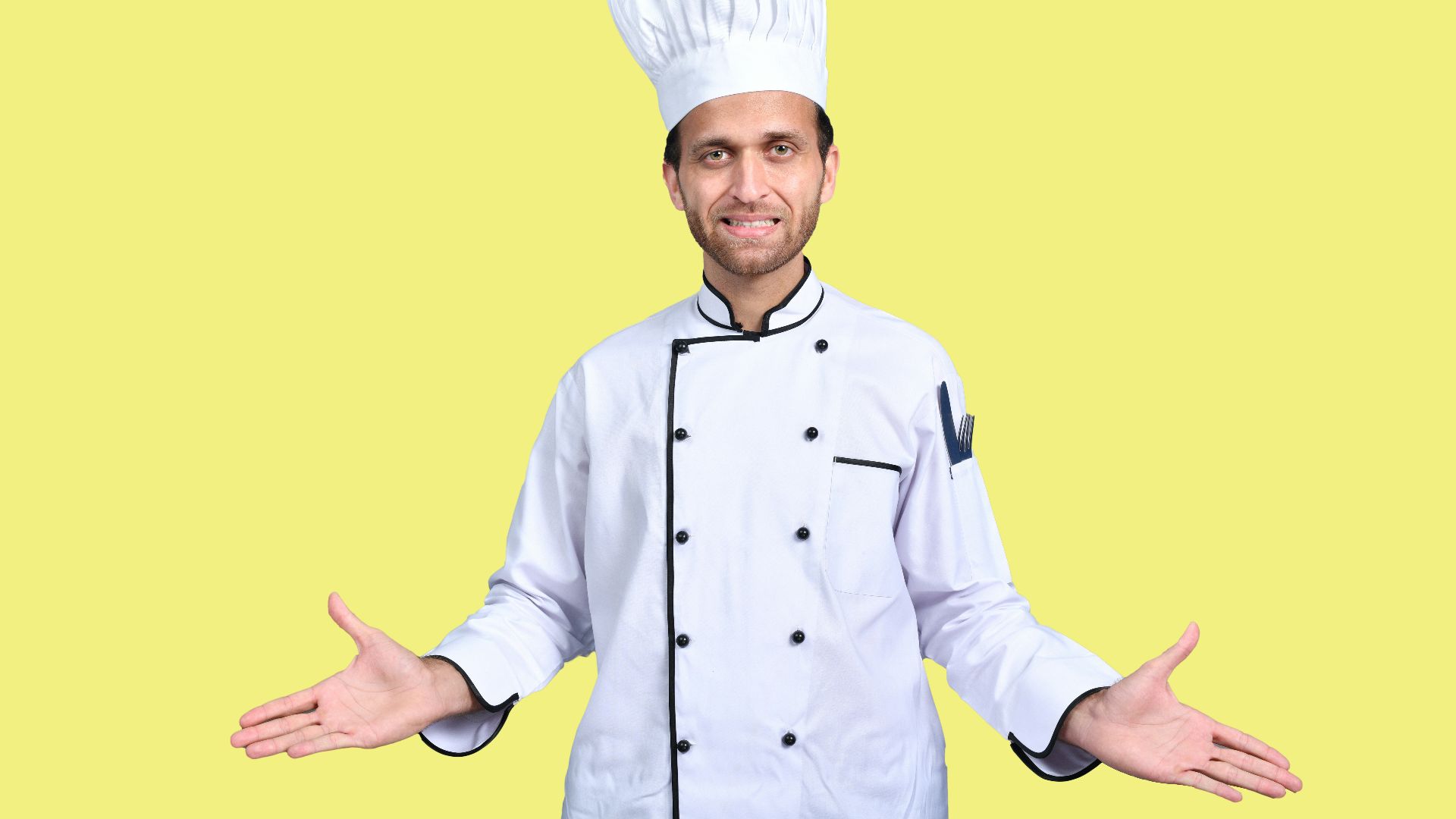 a man wearing a chef's hat and standing in front of a yellow background