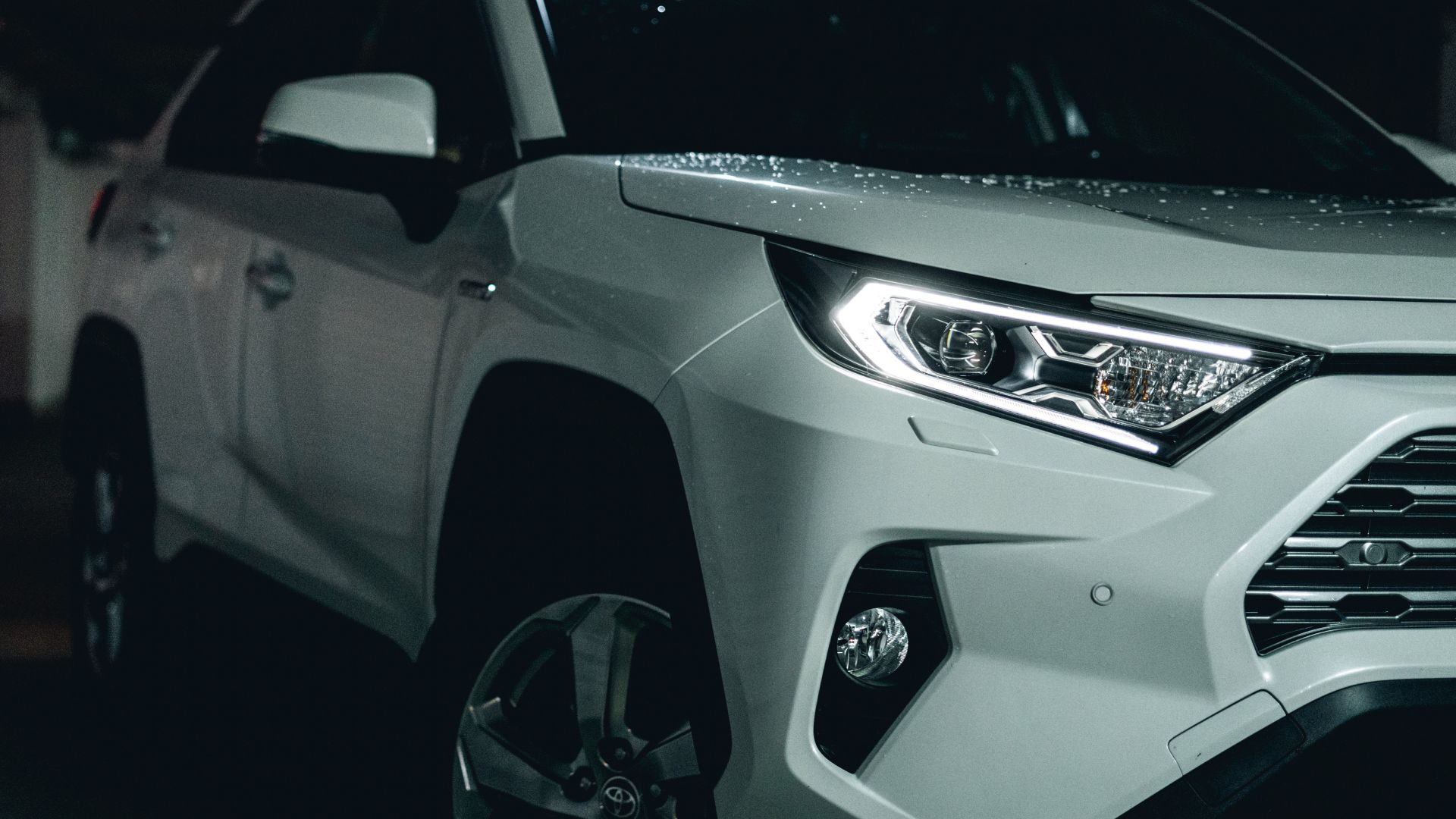 white and black car on black asphalt road