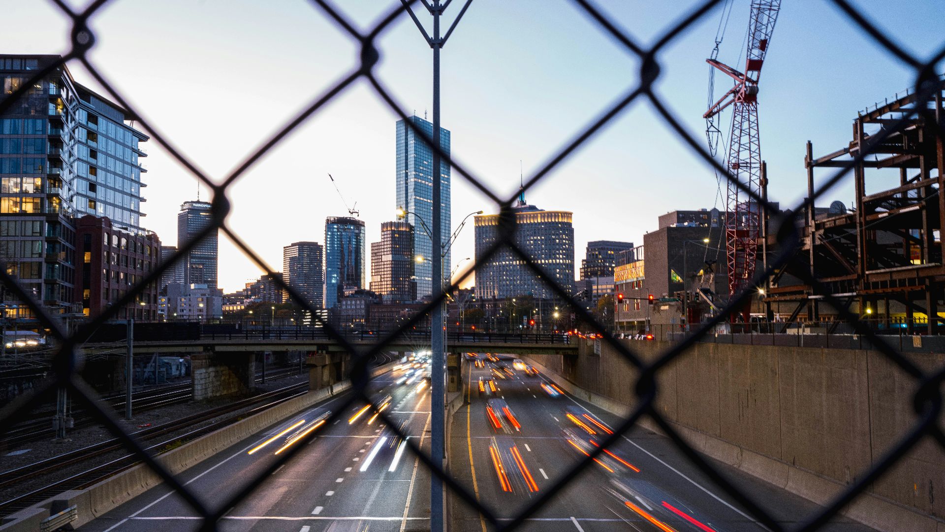 a city street with cranes