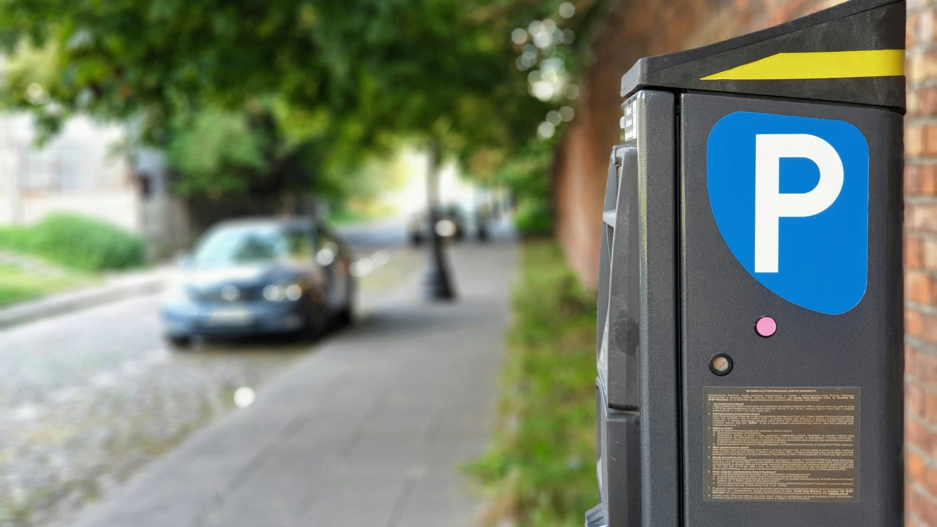 black car parked on sidewalk during daytime