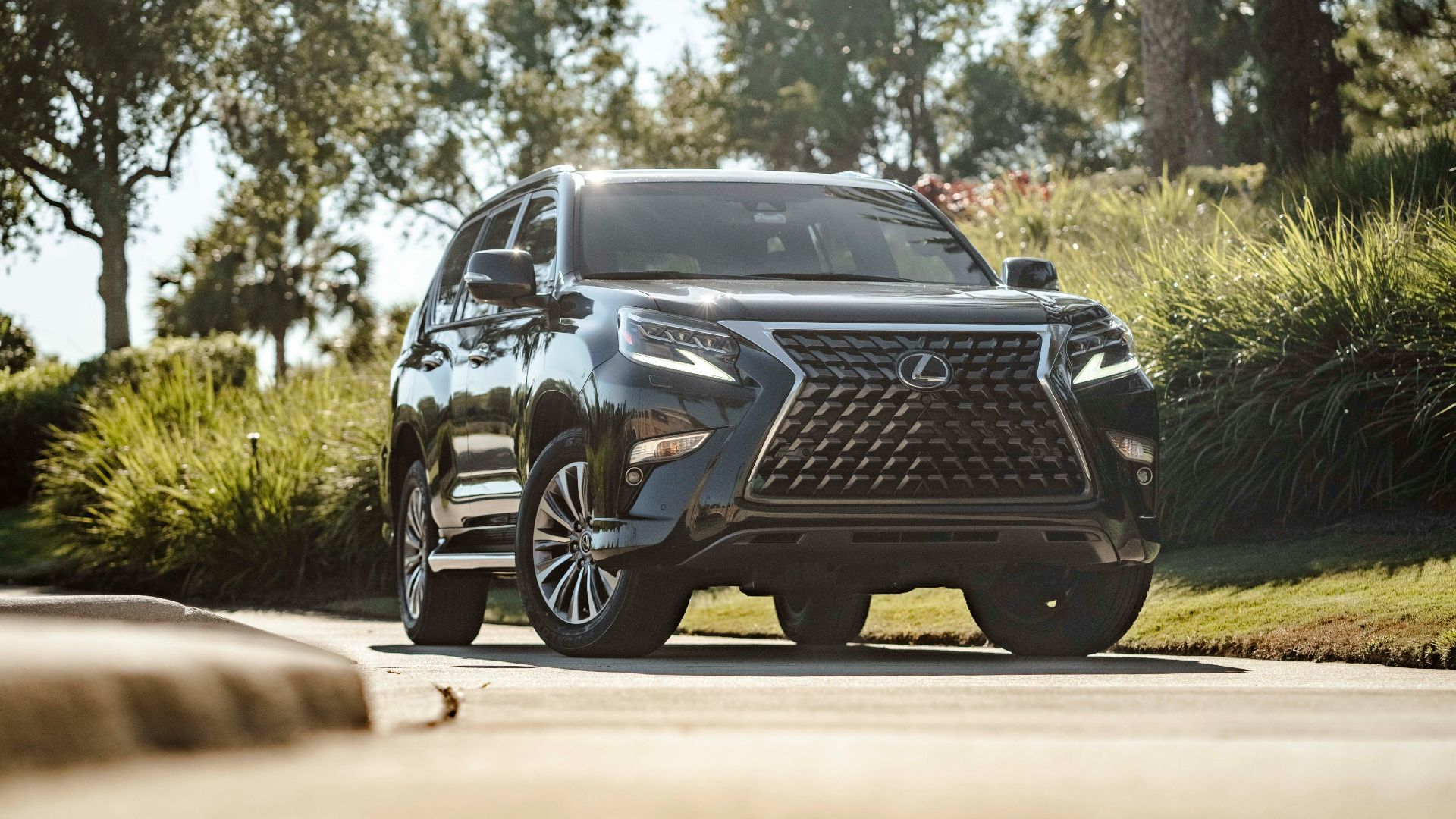 a black suv parked on the side of the road