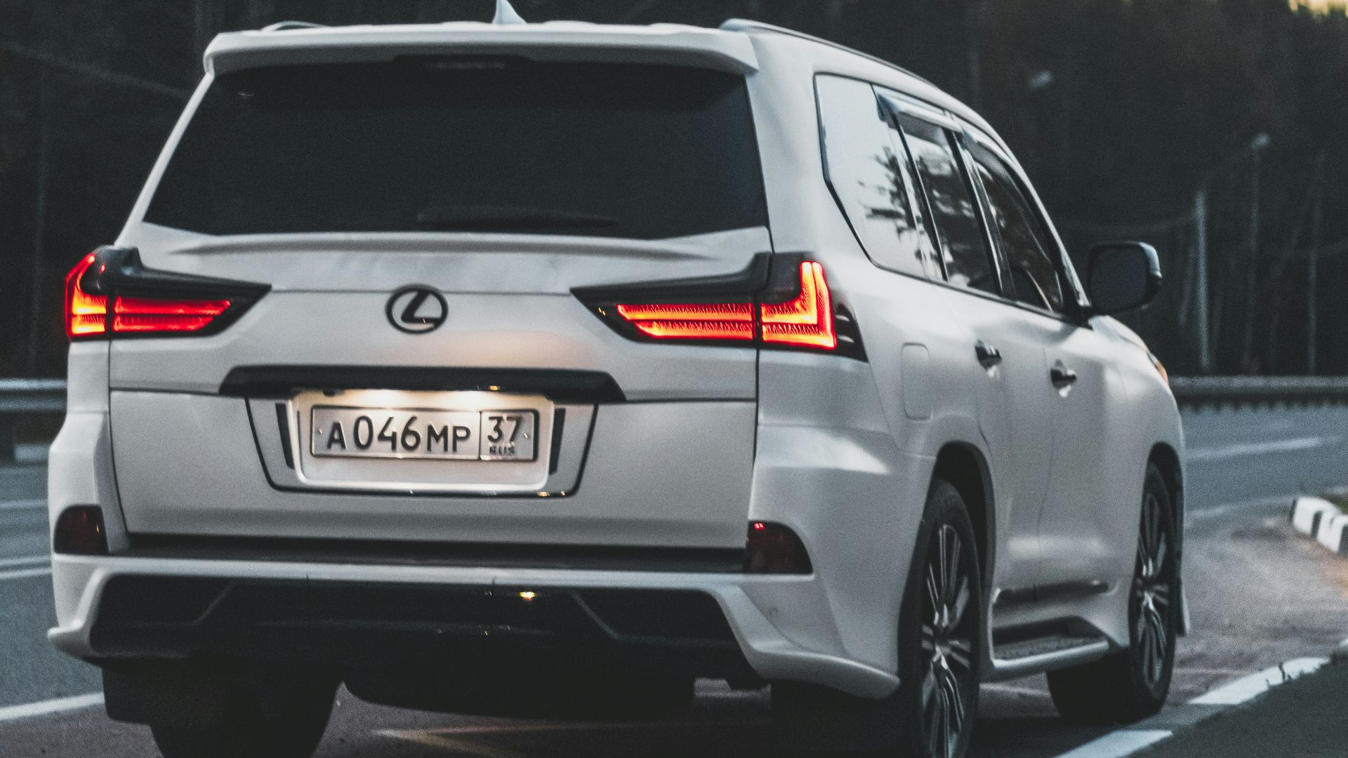 white mercedes benz g class on road during daytime