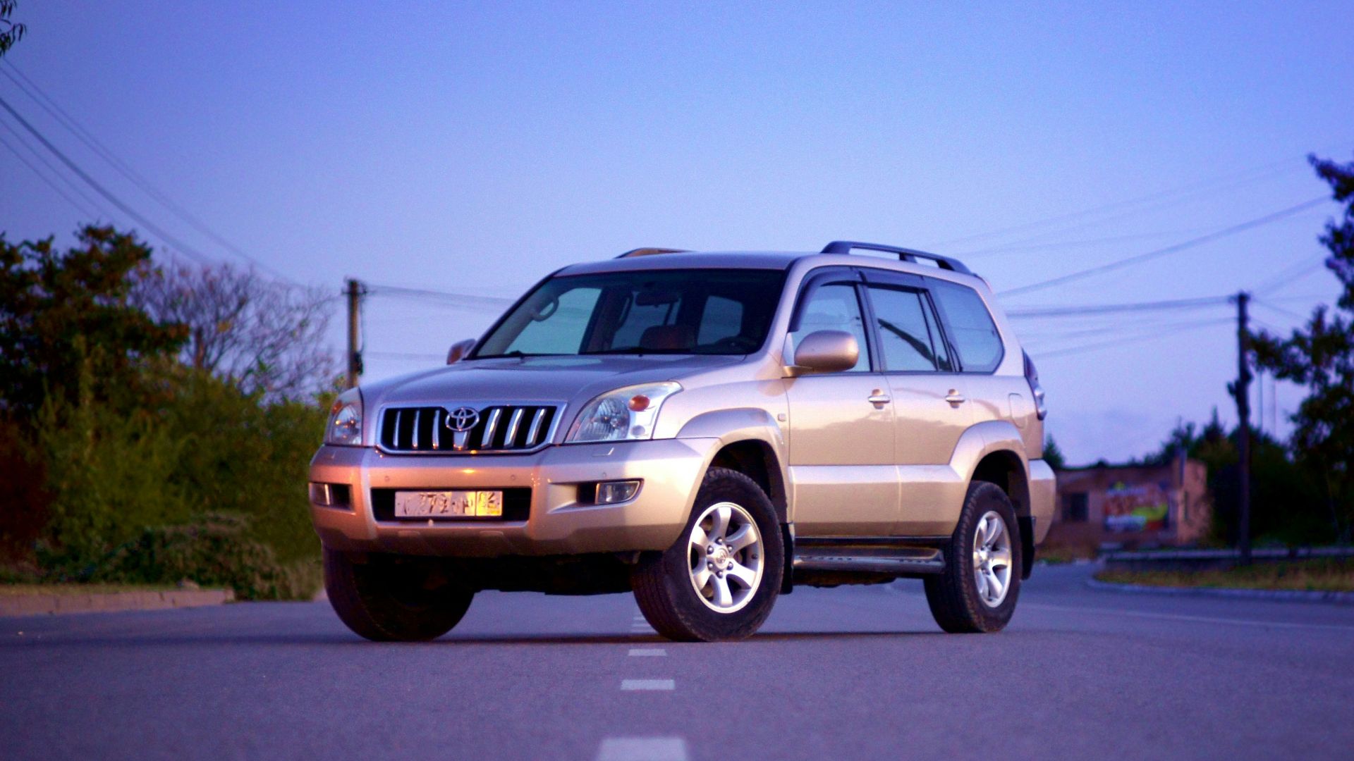 white suv on road during daytime