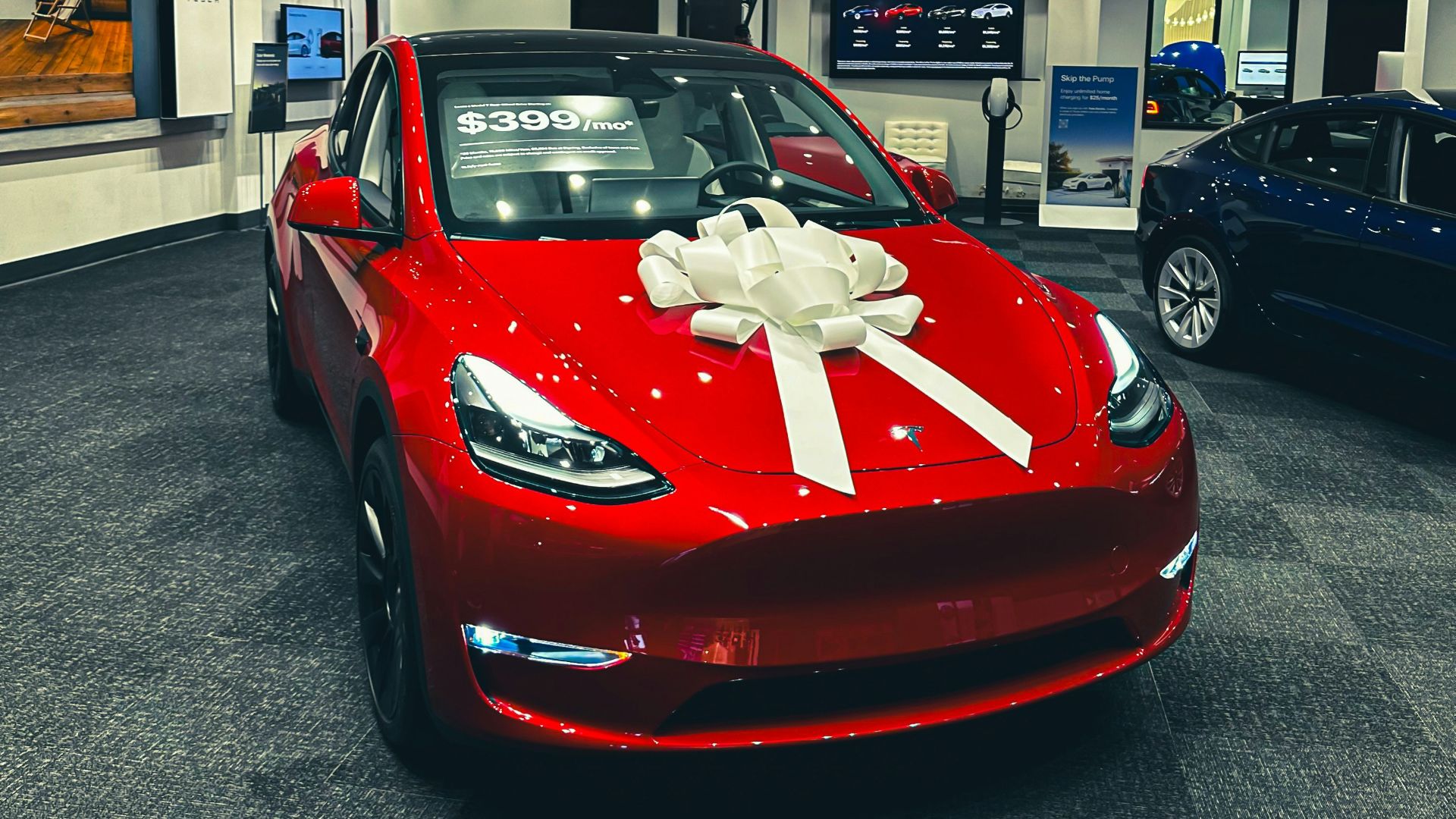 a red car with a white bow on it