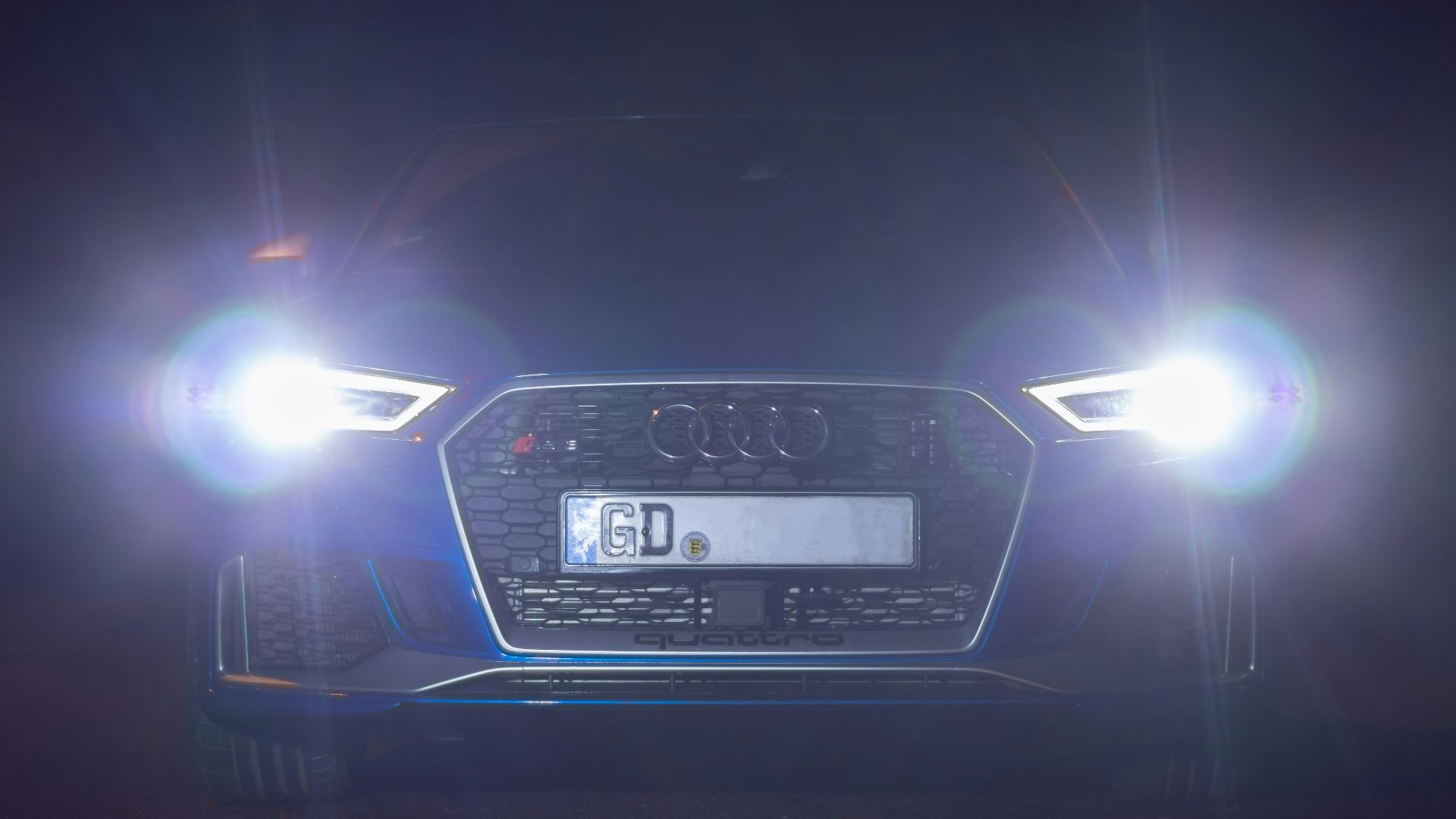 black car on road during night time