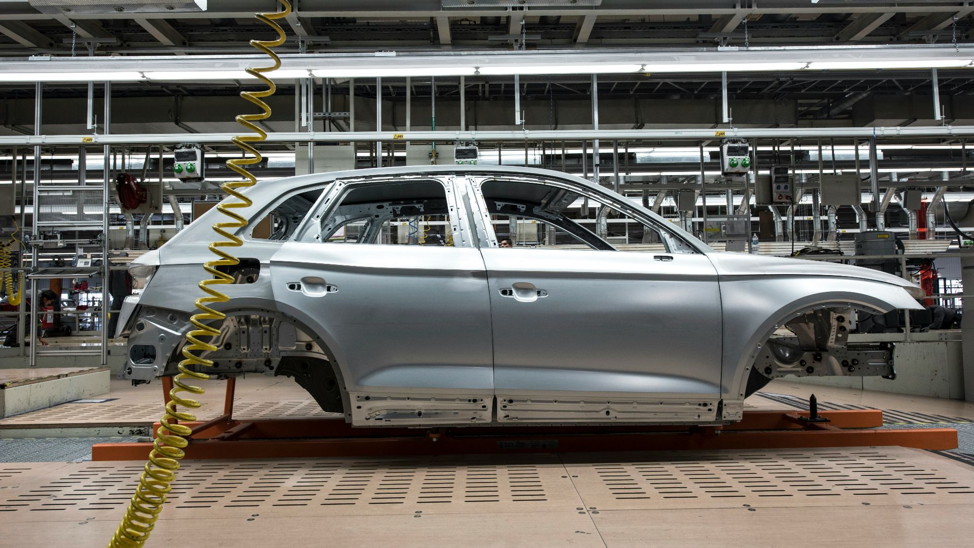 white sedan on a parking lot